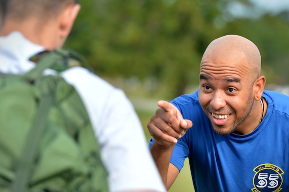 U.S. Air Force Senior Airman Rodney Foxworth-Hill, 55th Fighter Squadron aviation resource management technician, waits for an Airman to answer a trivia question as part of an obstacle course during the 20th Operations Group-hosted warrior day challenge at Shaw Air Force Base, S.C., May 19, 2017. Foxworth-hill quizzed Airmen on fighter squadron and Air Force trivia throughout the course. (U.S. Air Force photo by Airman 1st Class Christopher Maldonado)