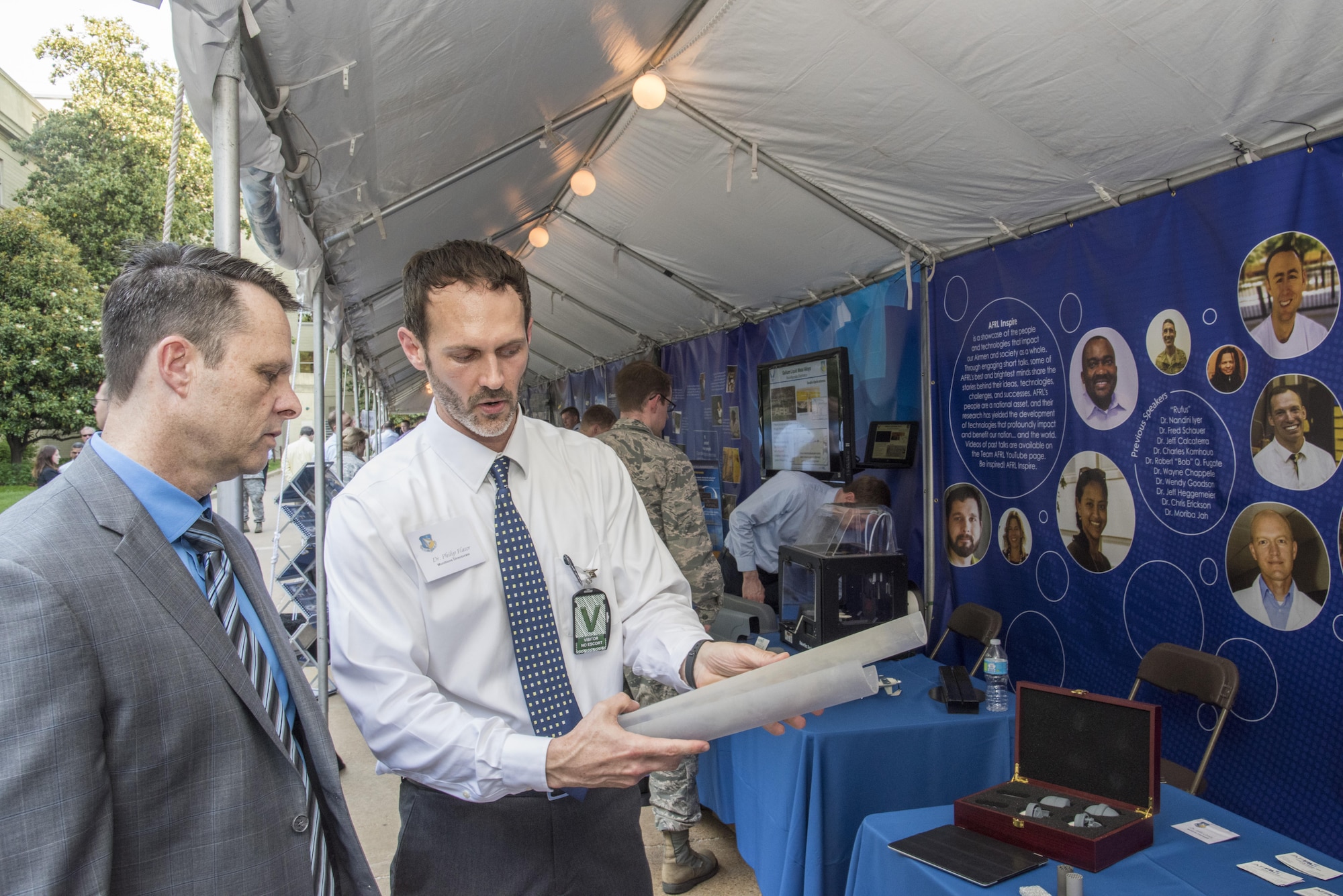 Dr. Phillip Flater, a mechanical engineer with the Air Force Research Laboratory’s Munitions Directorate at Eglin AFB, Florida, briefs Jeff H. Stanley, deputy assistant secretary of the Air Force for science, technology, and engineering, on Advanced Ordnance Technologies during the second biennial DoD Lab Day May 18, 2017 at the Pentagon center courtyard. (U.S. Air Force photo/Mikee Huber)