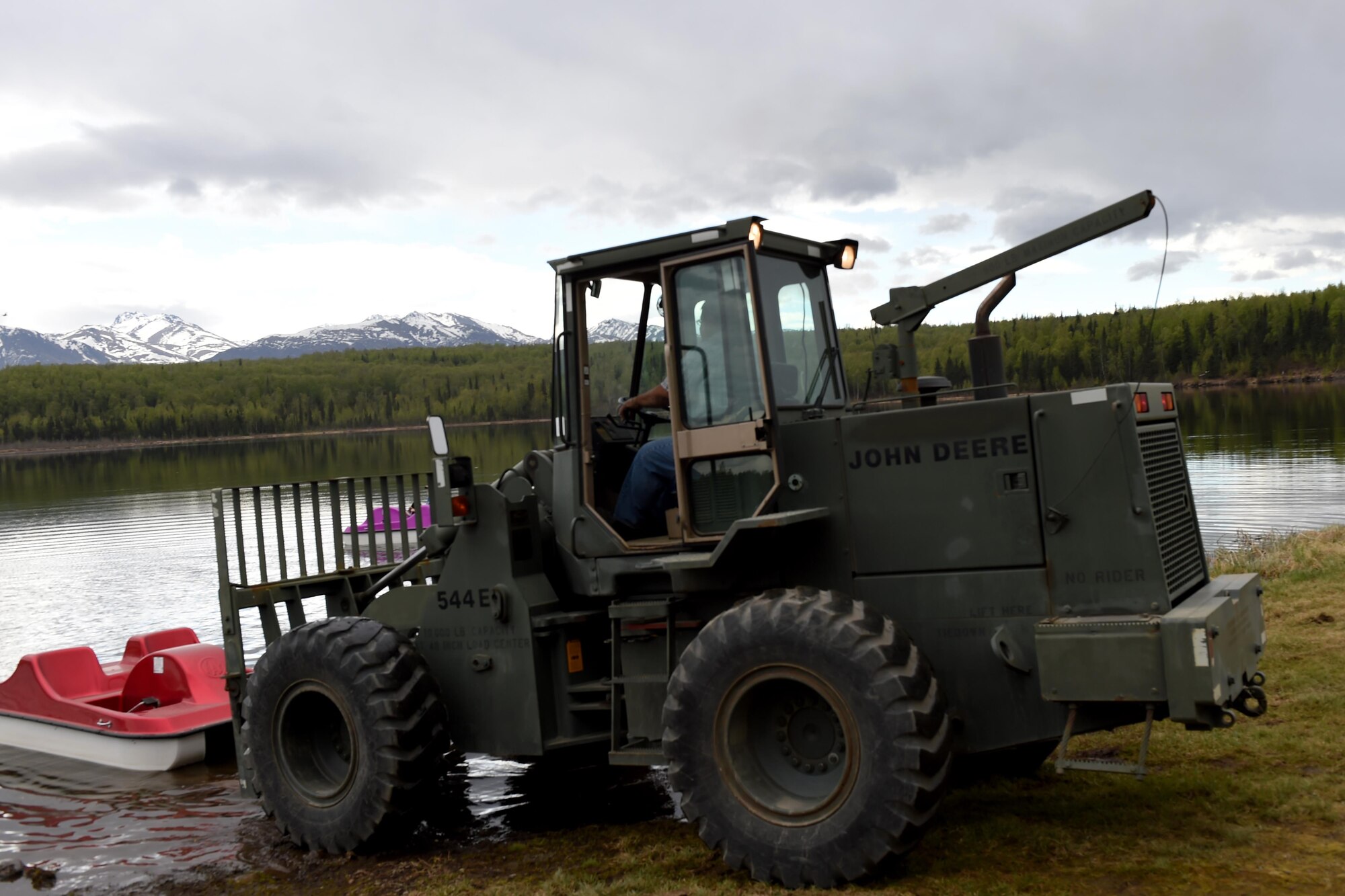Paddle boats are delivered to Otter Lake at Joint Base Elmendorf-Richardson, Alaska, May 17, 2017. Otter Lake opened to spring and summer recreating May 22. People with JBER access can bring their non-motorized boats, or rent one of the many available boats as they spend the day recreating at Otter Lake. 