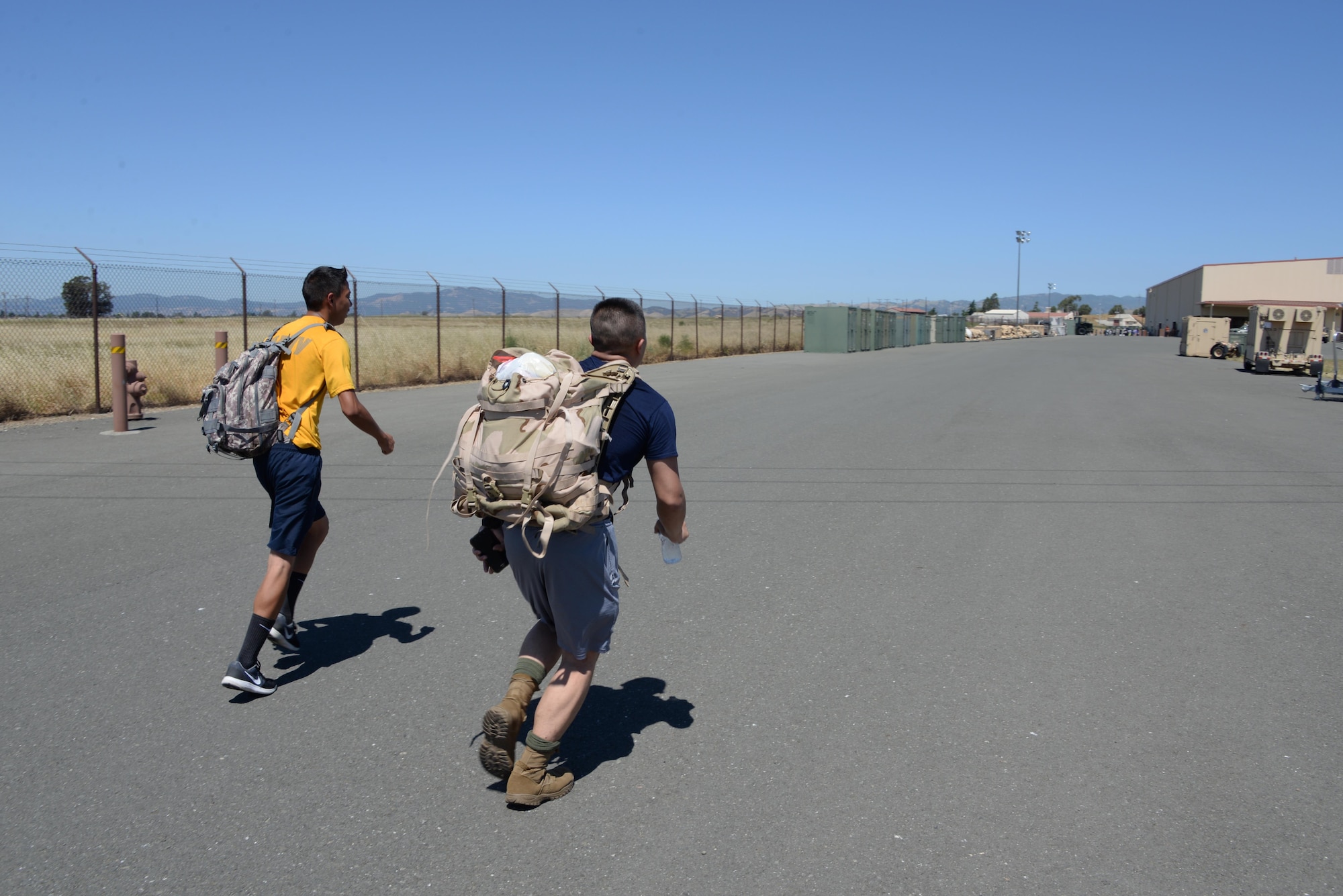 Military members and their families participate in the 7th Annual Gold Star Families Ruck March May 20, 2017 at Travis Air Force Base, Calif. The event, which featured 275 participants, is held every year by the Travis First Sergeant's Council to support Gold Star Families. (U.S. Air Force photo/Tech. Sgt. James Hodgman)