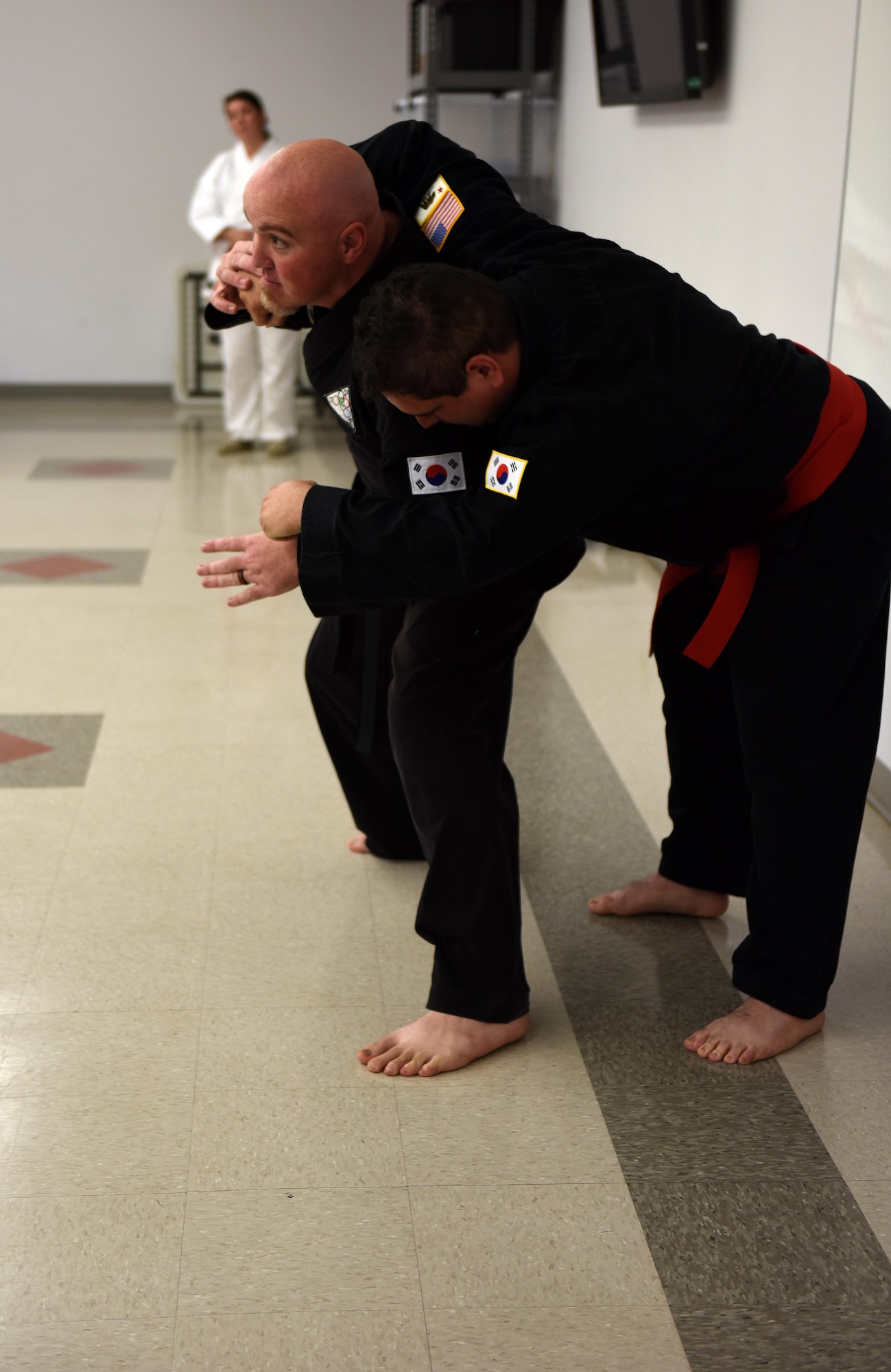 Douglas Mase, martial arts instructor, demonstrates Asian traditional martial arts during the Asian-American and Pacific-Islander observation day at the Taylor Chapel on Goodfellow Air Force Base, Texas, May 23, 2017. Mase described the origin and differences of various arts such as Aikido, Tang Soo Do and Kung Fu. (U.S. Air Force photo by Airman 1st Class Caelynn Ferguson/Released)