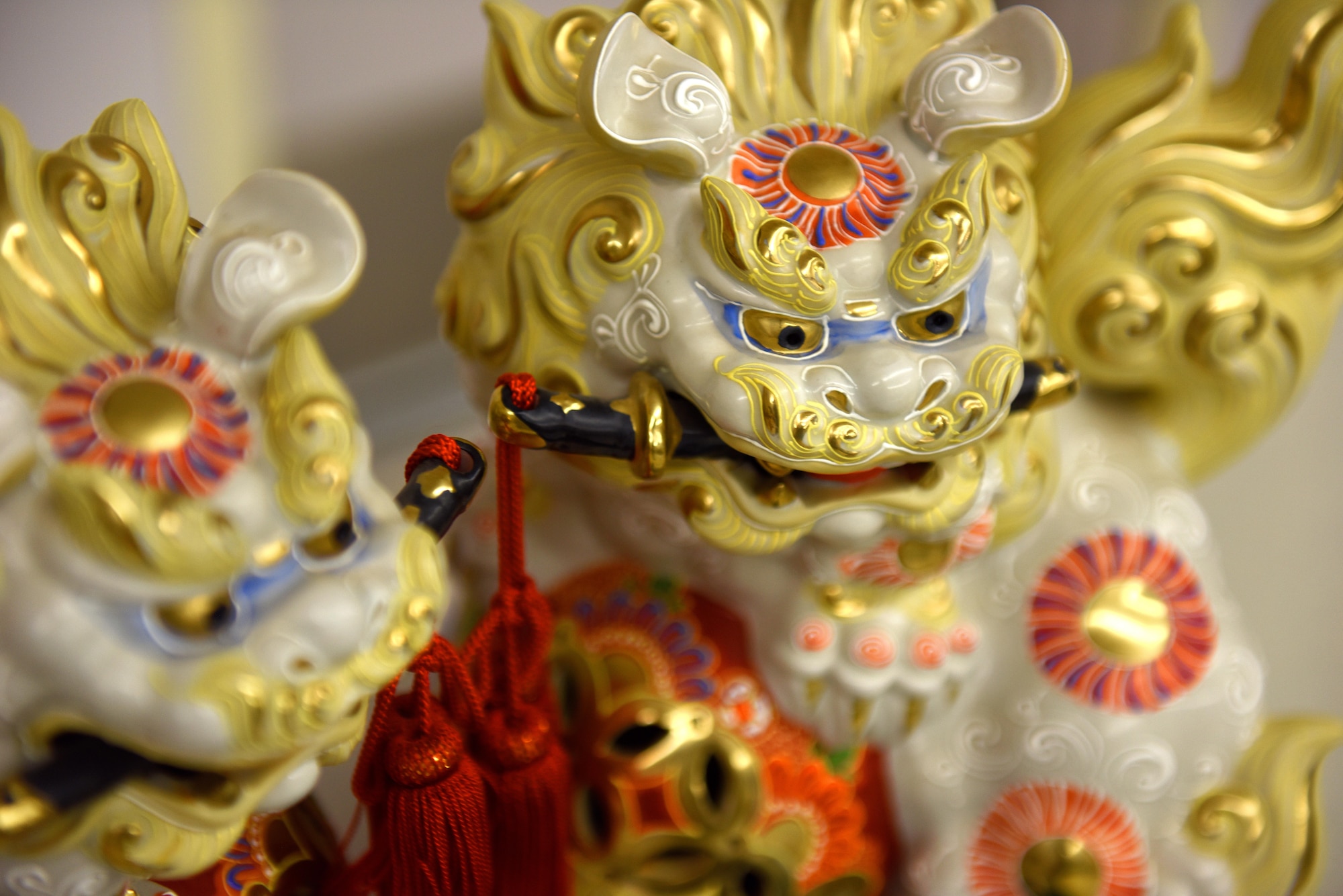 Glaring ‘foo dogs’, Asian protective statues, stand on display during the Asian-American and Pacific-Islander observation day at the Taylor Chapel on Goodfellow Air Force Base, Texas, May 23, 2017. The statues come in pairs, representing equal yet opposite aspects as ‘yin’ and ‘yang’. (U.S. Air Force photo by Airman 1st Class Caelynn Ferguson/Released)