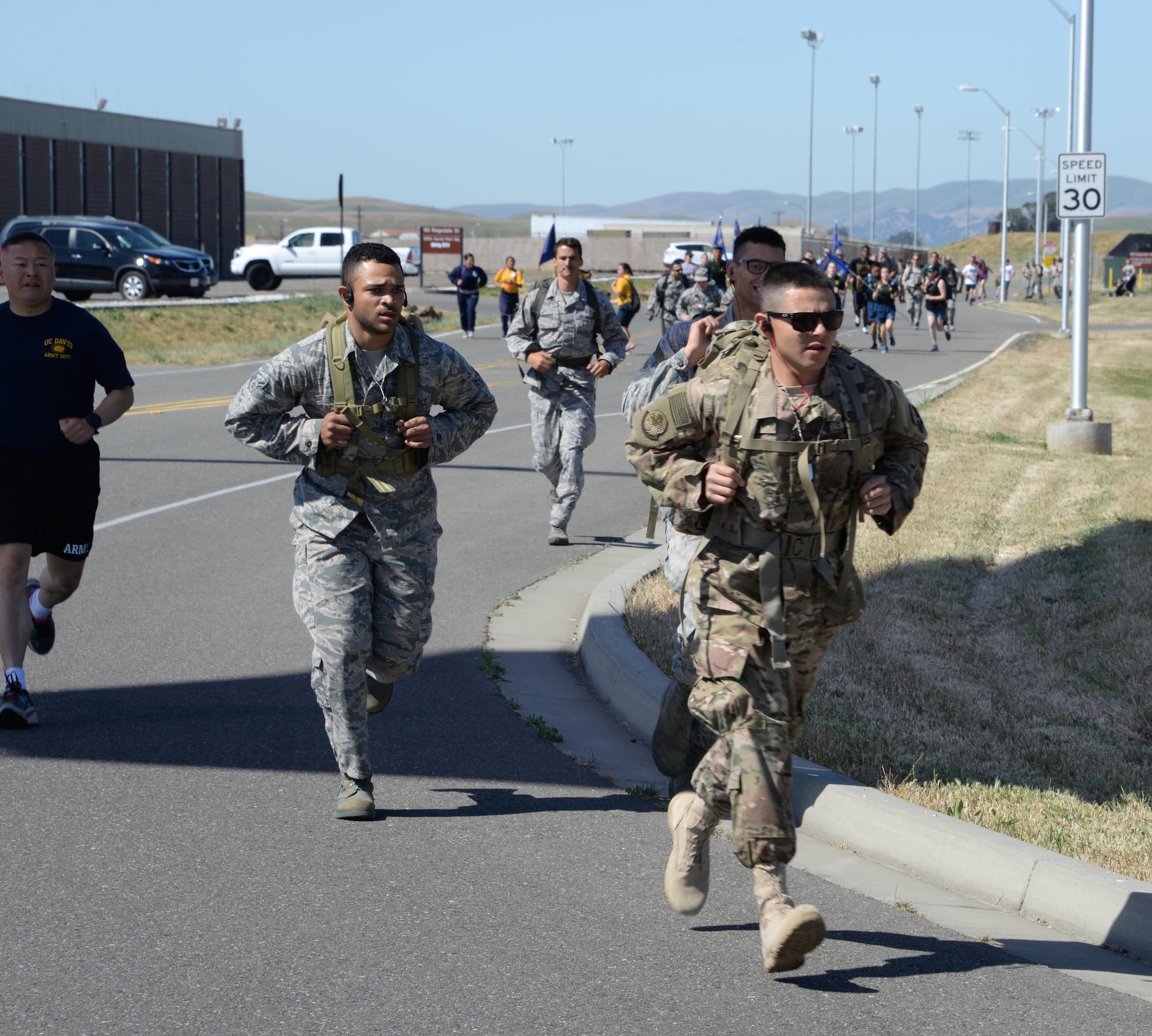 Military members and their families participate in the 7th Annual Gold Star Families Ruck March May 20, 2017 at Travis Air Force Base, Calif. The event, which featured 275 participants, is held every year by the Travis First Sergeant's Council to support Gold Star Families. (U.S. Air Force photo/Tech. Sgt. James Hodgman)