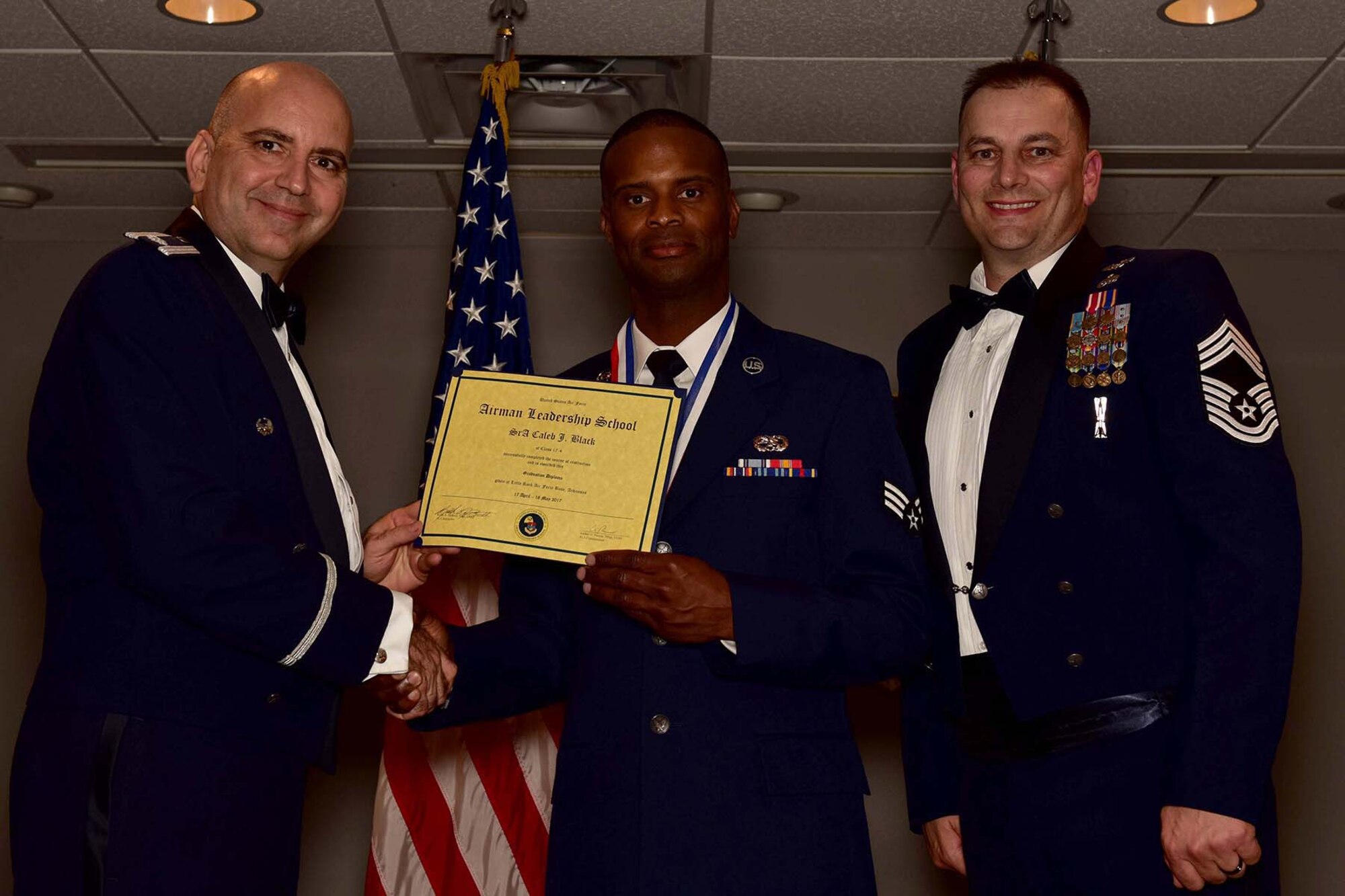 U.S. Air Force Reserve Lt. Col. Paul Centinaro, commander of the 913th Maintenance Squadron, Senior Airman Caleb J. Black, crew chief, 913th MXS and Chief Master Sgt. Scotty Rodgers, deputy superintendent, 913th MXS, pose for a photo during the Airman Leadership School (ALS) graduation ceremony at Little Rock Air Force Base, Ark., May 18, 2017. ALS is an Air Force education program held at base level to prepare senior Airmen for positions of greater responsibility. The course teaches leadership skills required of supervisors and reporting officials throughout the Air Force. (U.S. Air Force photo by Staff Sgt. Jeremy McGuffin/Released)