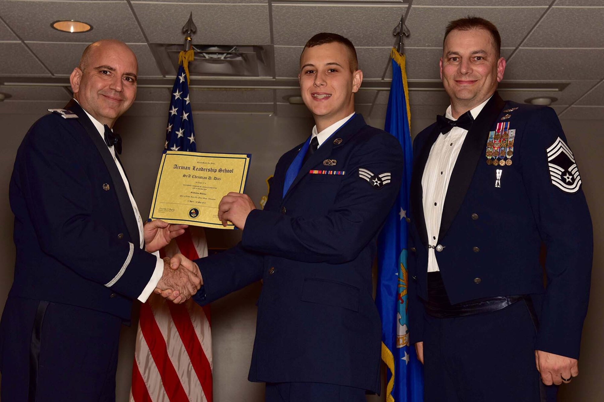 U.S. Air Force Reserve Lt. Col. Paul Centinaro, commander of the 913th Maintenance Squadron, Senior Airman Christian D. Diaz, aerospace propulsion, 913th MXS and Chief Master Sgt. Scotty Rodgers, deputy superintendent, 913th MXS, pose for a photo during the Airman Leadership School (ALS) graduation ceremony at Little Rock Air Force Base, Ark., May 18, 2017. ALS is an Air Force education program held at base level to prepare senior Airmen for positions of greater responsibility. The course teaches leadership skills required of supervisors and reporting officials throughout the Air Force. (U.S. Air Force photo by Staff Sgt. Jeremy McGuffin/Released)