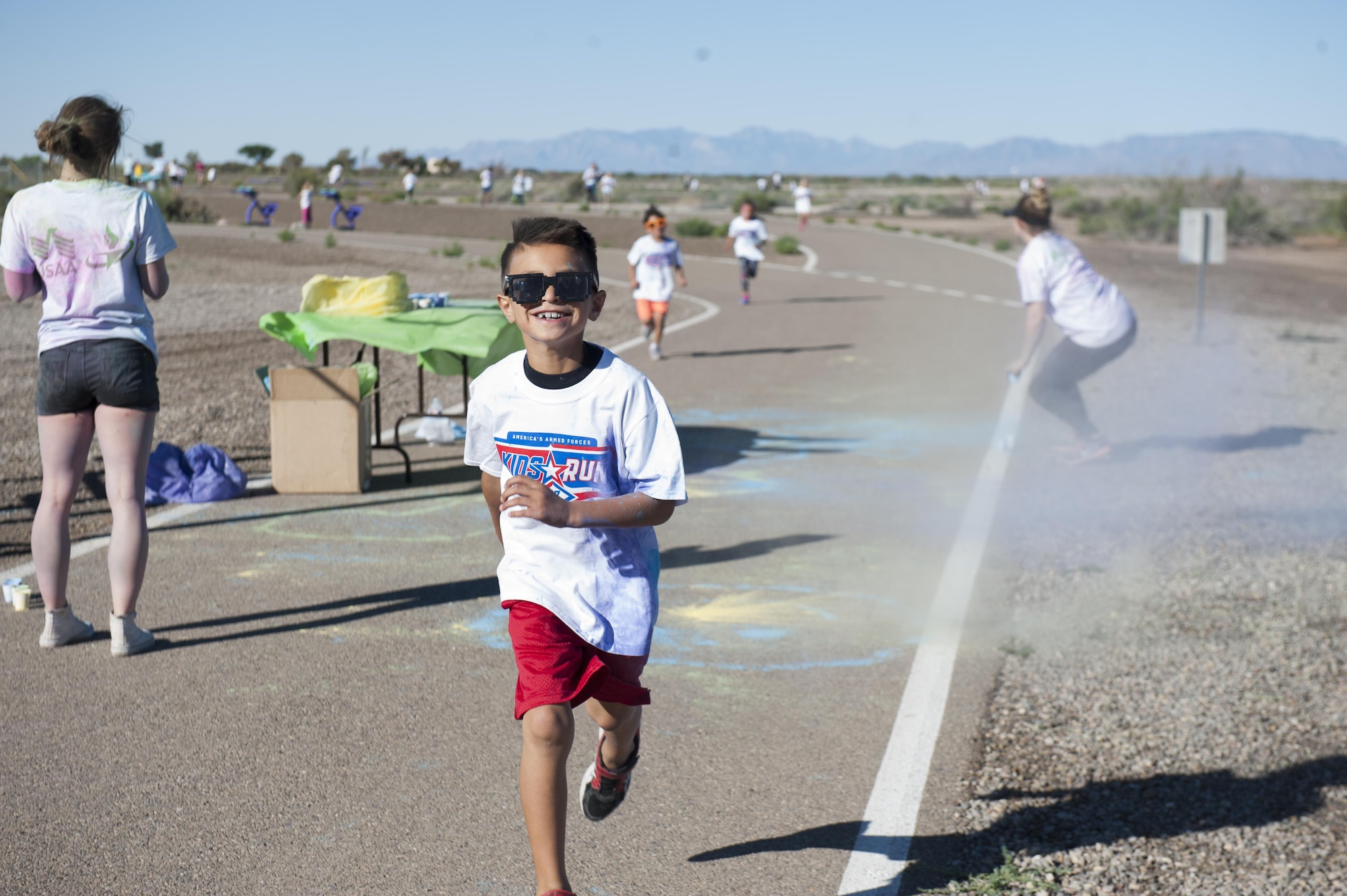 The Youth and Teen Center hosted the Art Blast color run 5K and the America’s Armed Forces Kids fun run at Holloman Air Force Base, N.M on May 20, 2017. During the run, younger children run a half mile, seven and eight year olds run one mile, and the older children run two miles. (U.S. Air Force photo by Airman 1st Class Ilyana A. Escalona)