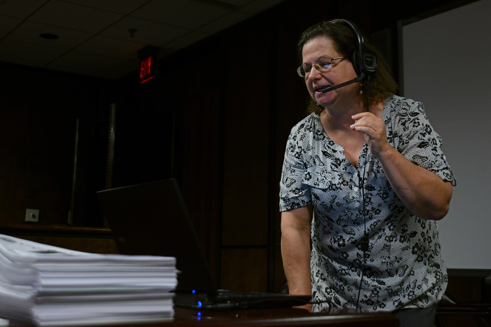 Doris Craven, 20th Fighter Wing Judge Advocate court reporter, speaks into a headset at Shaw Air Force Base, S.C., May 9, 2017. Craven uses a speech recognition program to convert spoken word into a written document of court proceedings. (U.S. Air Force photo by Airman 1st Class Kathryn R.C. Reaves)