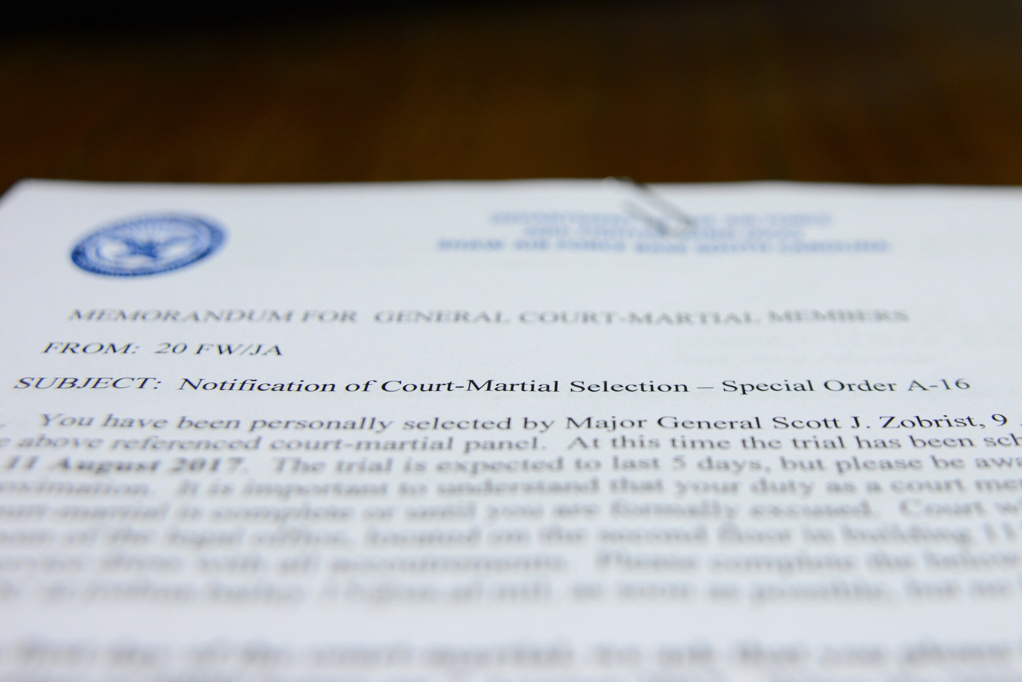 A notification of court-martial selection sits on a desk in a 20th Fighter Wing Judge Advocate office at Shaw Air Force Base, S.C., May 9, 2017. The document is delivered to Airmen selected as court members for a convening of court by Major General Scott Zobrist, 9th Air Force commander. (U.S. Air Force photo by Airman 1st Class Kathryn R.C. Reaves)