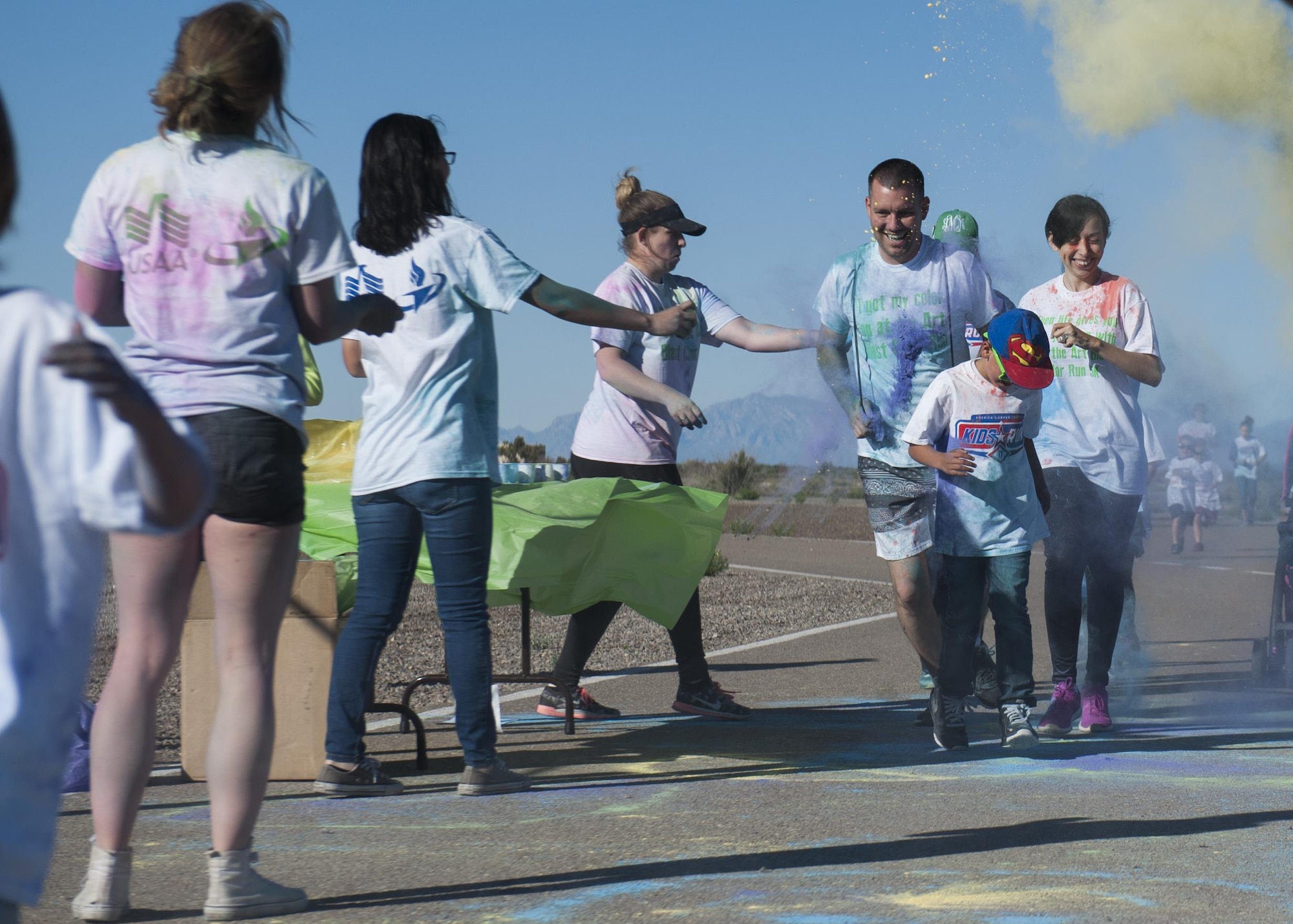 The Youth and Teen Center hosted the Art Blast color run 5K and the America’s Armed Forces Kids fun run at Holloman Air Force Base, N.M on May 20, 2017. During the run, volunteers set up tables along the track with various colored paint powder to toss at the runners transforming their fresh white shirts into a colorful canvas. (U.S. Air Force photo by Airman 1st Class Ilyana A. Escalona)