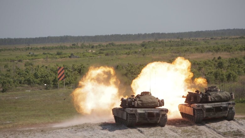 Marines deliver synchronized fire in their M1A1 Abrams tanks during a fire mission at Marine Corps Base Camp Lejeune, N.C., May 17, 2017. The Marines are participating in Burmese Chase, an annual, multi-lateral training exercise between U.S. armed forces and NATO members.