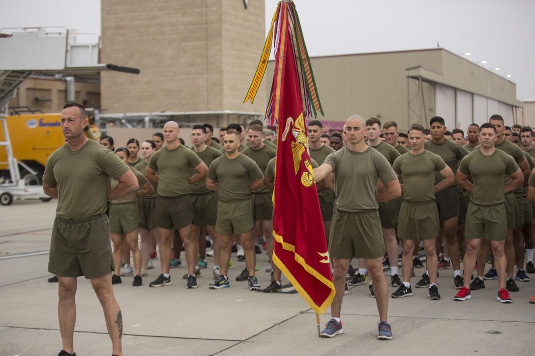 Marines with Marine Aircraft Group (MAG) 39 stand in formation prior to running the MAG-39 “Victory Lap” around the flightline at Marine Corps Air Station Camp Pendleton, Calif., May 22. Marines from 11 squadrons in MAG-39 participated in the run to celebrate a year of aviation excellence. (U.S. Marine Corps photo by Lance Cpl. Liah Smuin/Released)