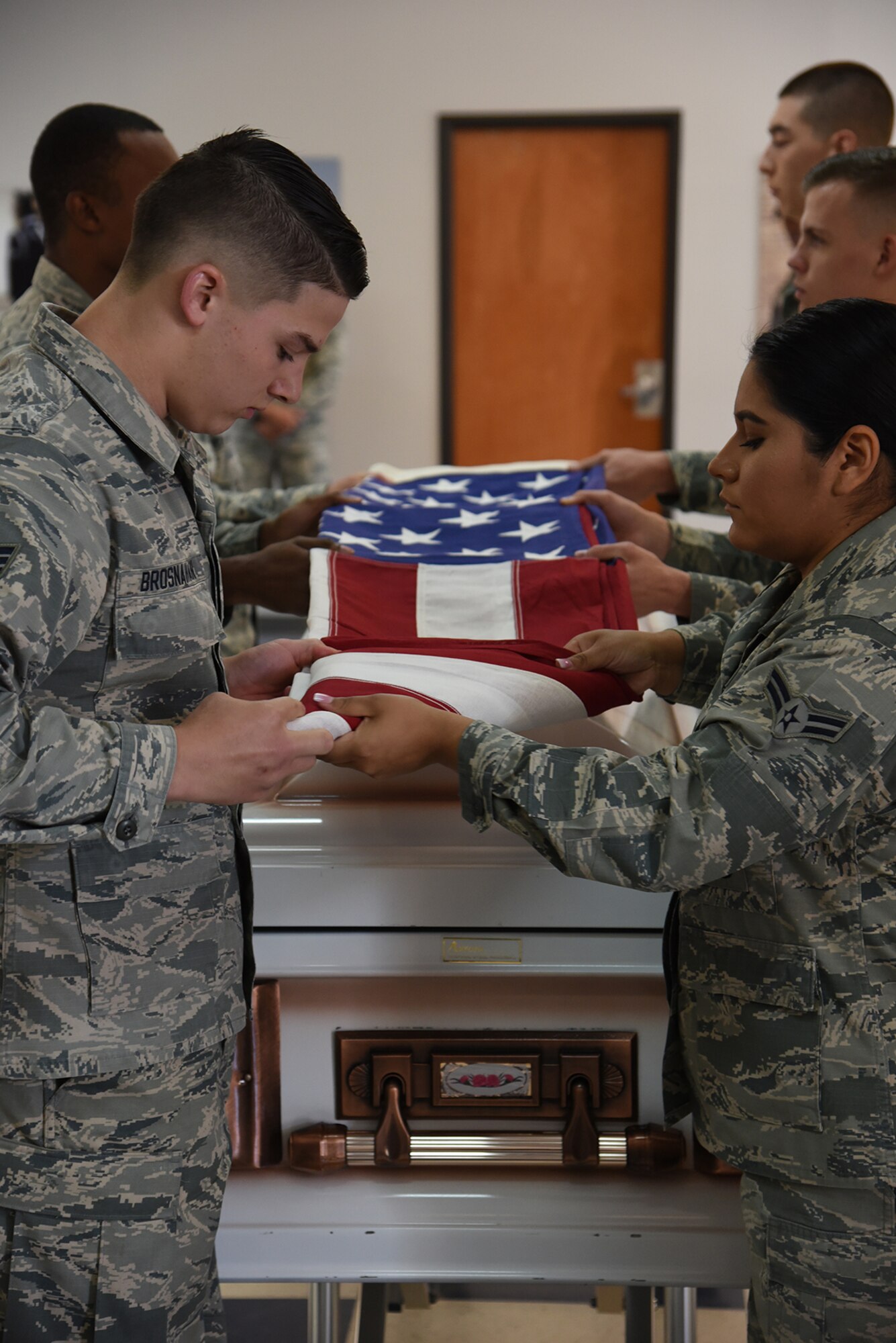PETERSON AIR FORCE BASE, Colo. – Airmen of the High Frontier Honor Guard, Class 17-Alpha, perform a flag folding ceremony during their graduation at Peterson Air Force Base, Colo., May 19, 2017. They will display their skills at official Air Force functions for the next 6 months. (U.S. Air Force photo by Robb Lingley)