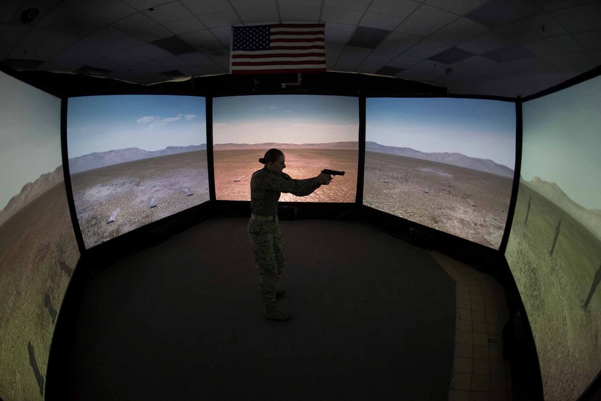 PETERSON AIR FORCE BASE, Colo. – Staff Sgt. Andrea Brunsvold, 21st Security Forces Squadron, shoots targets in firing range simulator during an obstacle course for National Police Week, May 18, 2017 at Peterson Air Force Base, Colo. The obstacle course was one of several events the 21st Security Forces Squadron hosted for Police Week, May 15-19, including a distracted driving simulator, combatives tournament, and BBQ. (U.S. Air Force photo by Steve Kotecki)


