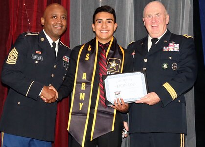 Retired Army Lt. Gen. Rick Lynch and Command Sgt. Maj. Juan Dozier pose with Roberto Enriquez, a future Solider, who was honored during Our Community Salutes-San Antonio’s 6th Annual “A Night in Your Honor” held in the Rosenberg Sky Room at the University of the Incarnate Word.  Each honoree received an Our Community Salutes certificate and challenge coin from USAA.