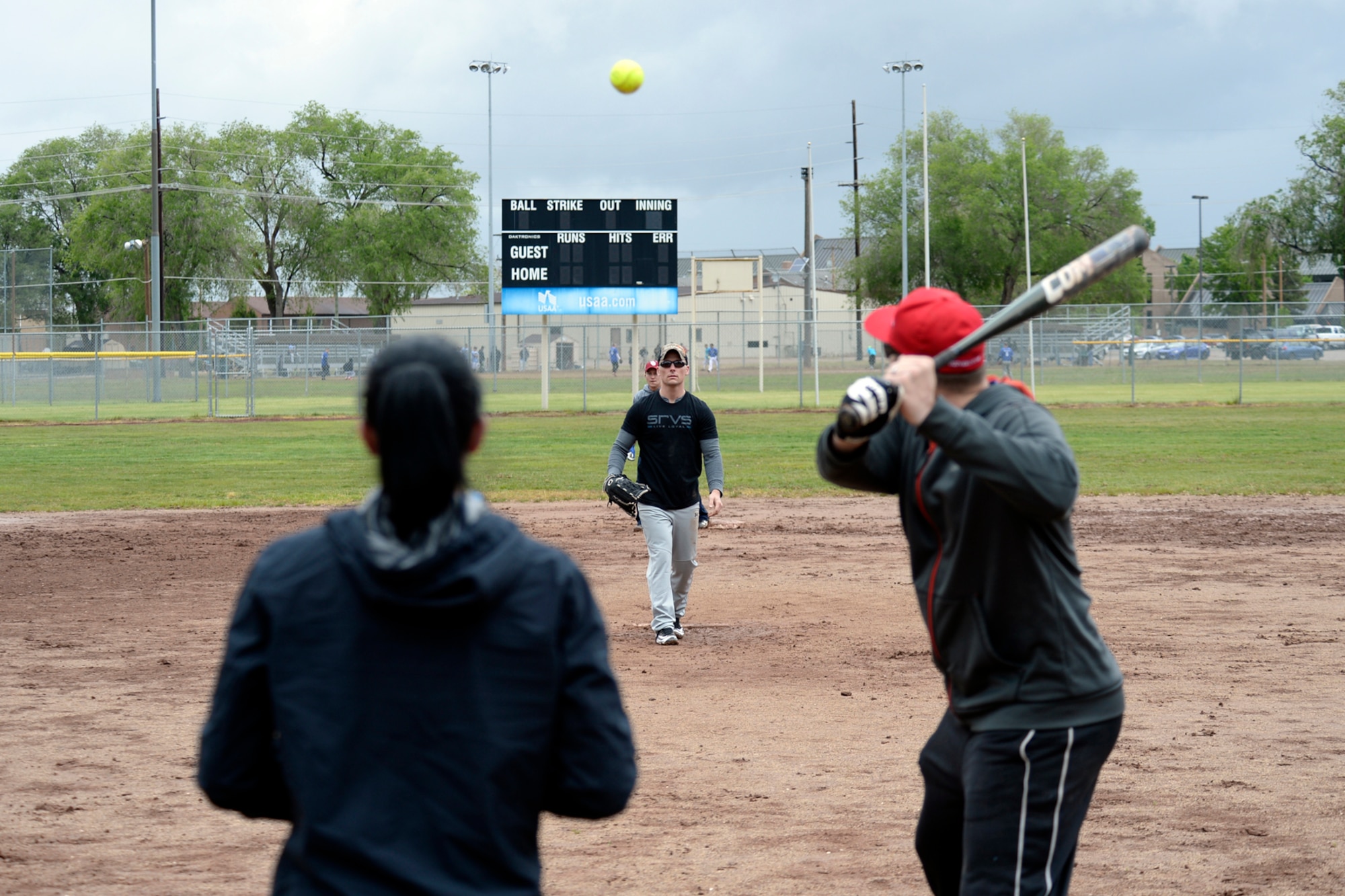 Staff Sgt. Jacob Sime, 75th Security Forces Squadron, pitches for "COP Team 1" during a first-round softball game May 16 at Hill Air Force Base, Utah. The Defenders Challenge Softball Tournament was organized by 75th Security Forces Airmen as one of several events celebrating National Police Week. (Air Force photo/Todd Cromar)