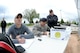 Staff Sgt. Joshua Rodriguez, foreground, Chief Master Sgt. Paul Stansbury and Staff Sgt. Ashley Schnaible, all assigned to the 75th Security Forces Squadron, keep score during a softball game, May 16 at Hill Air Force Base, Utah. The Defenders Challenge Softball Tournament was organized by 75th Security Forces Airmen as one of several events celebrating National Police Week. (Air Force photo/Todd Cromar)