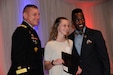 Maj. Gen. Troy D. Kok, commanding general of the U.S. Army Reserve’s 99th Regional Support Command (left), and Larance Kirby, executive director for the Delaware Commission of Veterans Affairs (right), recognize Raelyn Blevins, high-school student and future member of the Delaware Air National Guard, during the sixth-annual Our Community Salutes recognition ceremony May 16 at the Cavaliers County Club in Newark, Delaware.  Kok and Kirby joined Wilmington University and the Delaware Chapter, Association of the United States Army in honoring more than 100 high-school students who have volunteered to enlist in all branches of the U.S. military following graduation.