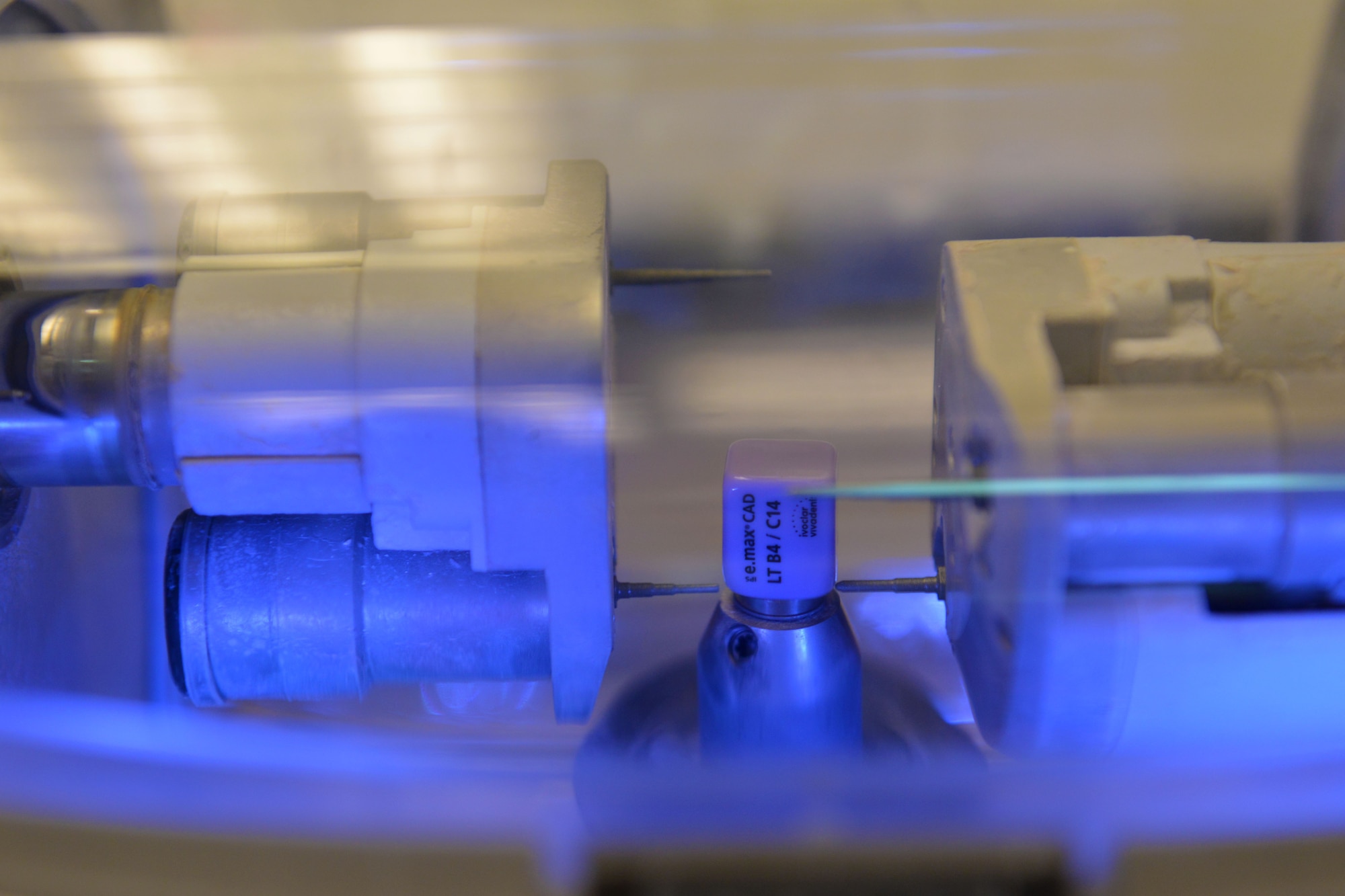 A chairside economical restoration of esthetic ceramics (CEREC) machine reads the dimensions of an E-max cube, used to make dental appliances, at Shaw Air Force Base, S.C., May 18, 2017. Dental laboratory technicians can digitally design crowns, commonly used to cover up a damaged tooth, which the CEREC creates by shaving down E-max cubes to match designated proportions of a patient’s tooth. (U.S. Air Force photo by Airman 1st Class Destinee Sweeney)