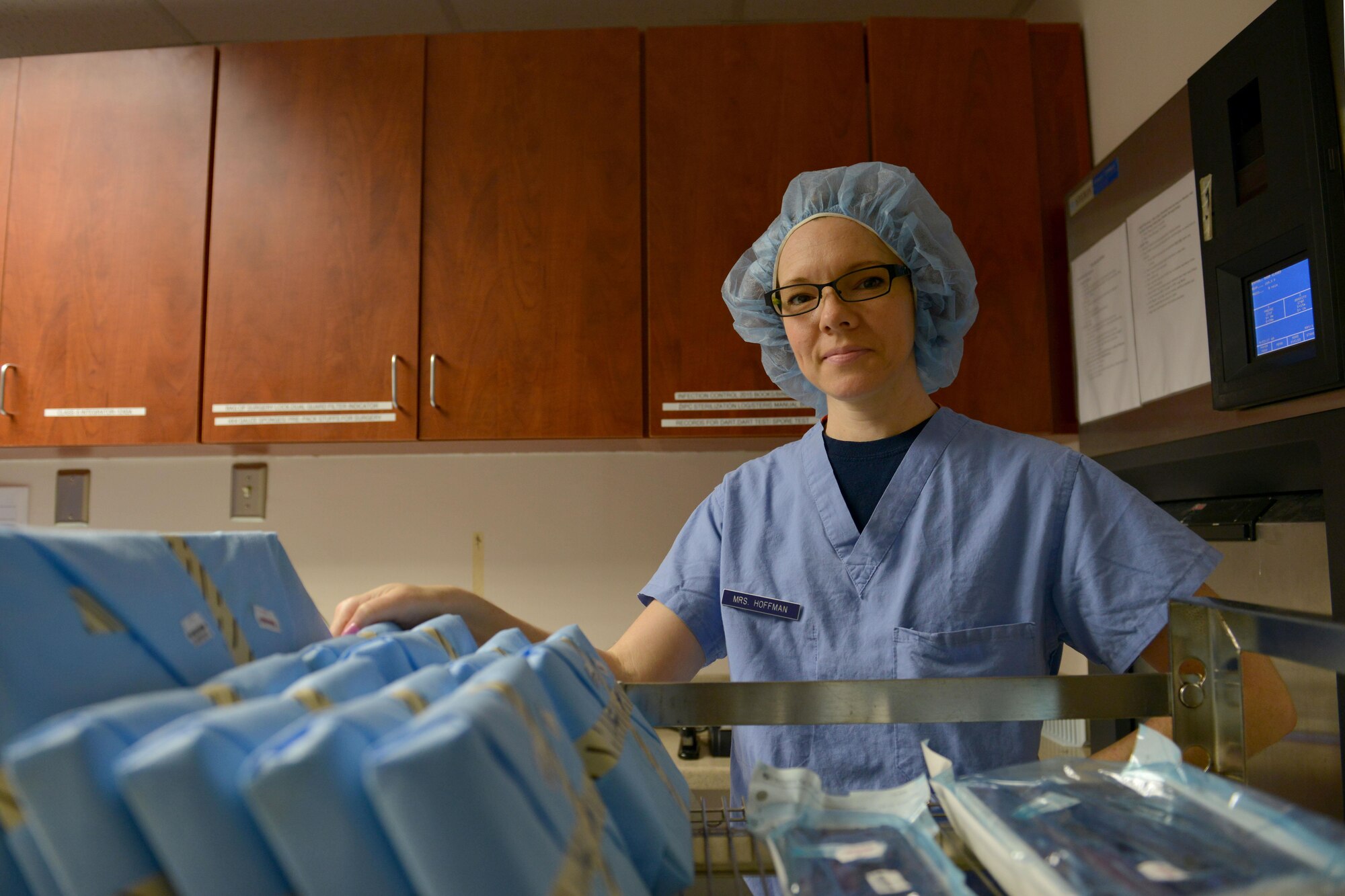 Janet Hoffman, 20th Dental Squadron centralized instrument processing center technician, stands for a picture at Shaw Air Force Base, S.C., May 18, 2017. Hoffman is responsible for sterilizing more than 14,000 20th Medical Group instruments, maintaining patient safety by eliminating the spread of bacteria. (U.S. Air Force photo by Airman 1st Class Destinee Sweeney)
