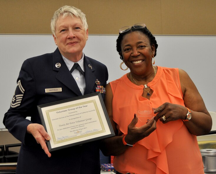 The annual Volunteer Appreciation Luncheon and Awards at the California Veterans Home, Yountville, recognizes groups and individuals who give selflessly to our treasured veterans living there. Travis Air Force Base Airmen were one of the groups receiving an award for all the volunteer efforts they provide throughout the year. Airmen from the 349th Air Mobility Wing have been serving the Thanksgiving meal for more than 25 years through Operation Give Thanks, and visiting on Father's Day weekend to provide a champagne brunch during Operation Gratitude. Additionally, groups of Airmen from the 349th and 60th AMWs, as well as the 621st Contingency Response Group, decorate the Home for the holidays with Operation Holiday Cheer, and help make the annual Fourth of July celebration the success it always is, by supporting events throughout the day, culminating with a grand fireworks display. Accepting the award for Travis here, is Senior Master Sgt., retired, Ellen Hatfield, 349th AMW public affairs, with Ms. Gwen Robinson, Home staff member. Not pictured is Mr. Joshua Kiser, Volunteer Coordinator, who organizes all the volunteers and their efforts. (courtesy photo)