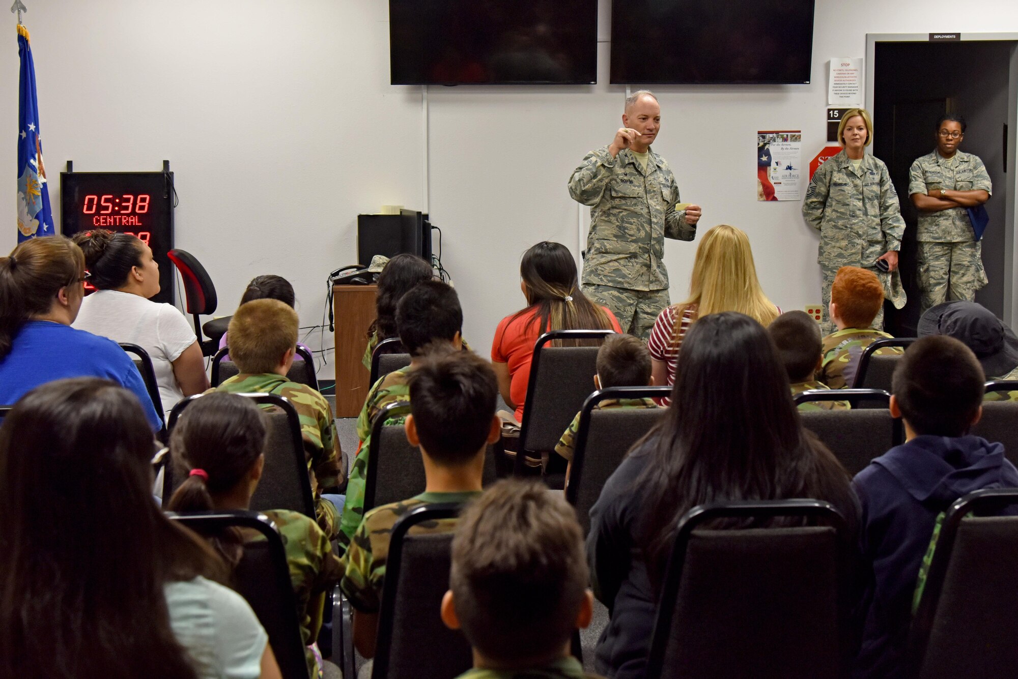 U.S. Air Force Col. Michael Downs, 17th Training Wing commander, briefs children for Operation: Kids Investigating Deployed Services at the Vance Deployment Center on Goodfellow Air Force Base, Texas, May 20, 2017. Operation: K.I.D.S. simulated a deployment and gave children a joint environment exposure. (U.S. Air Force photo by Staff Sgt. Joshua Edwards/Released)