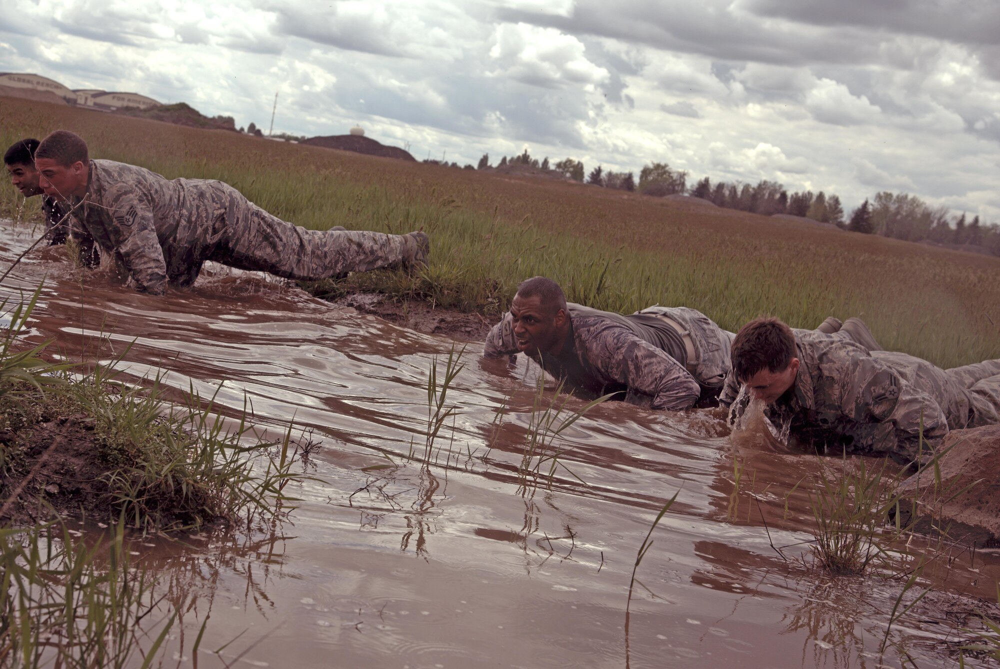 92nd Security Forces Squadron Airmen perform push-ups May 19, 2017, at Fairchild Air Force Base, Washington. Approximately 20 Airmen participated in various security forces themed events as part of National Police Week, to include: a shoot house competition, two-mile ruck and team workouts. (U.S. Air Force photo/Senior Airman Nick J. Daniello)