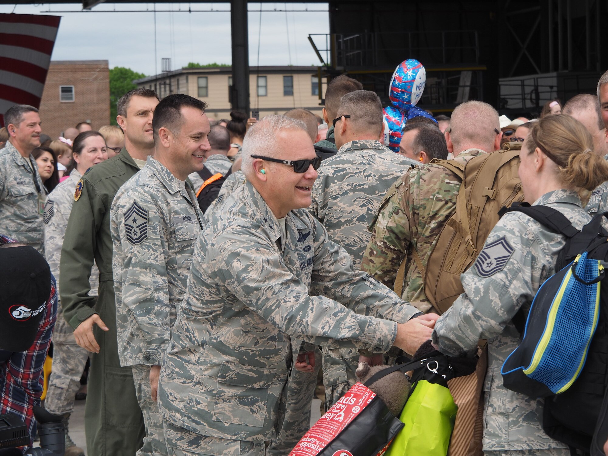 Maj. Gen. John Stokes, 22nd Air Force commander, greets members of the 934th Airlift Wing as they return from their four month deployment May 18. (Air Force Photo/Paul Zadach)