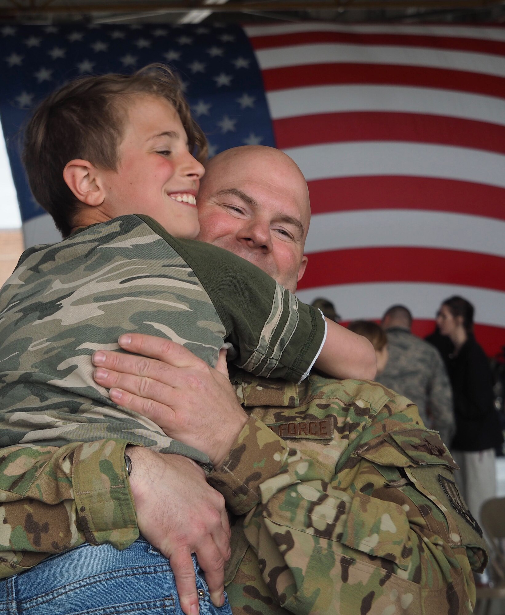 Maj. Kevin Eklund, 96th Airlift Squadron, reunites with his son May 18 after four month deployment. (Air Force Photo/Paul Zadach)