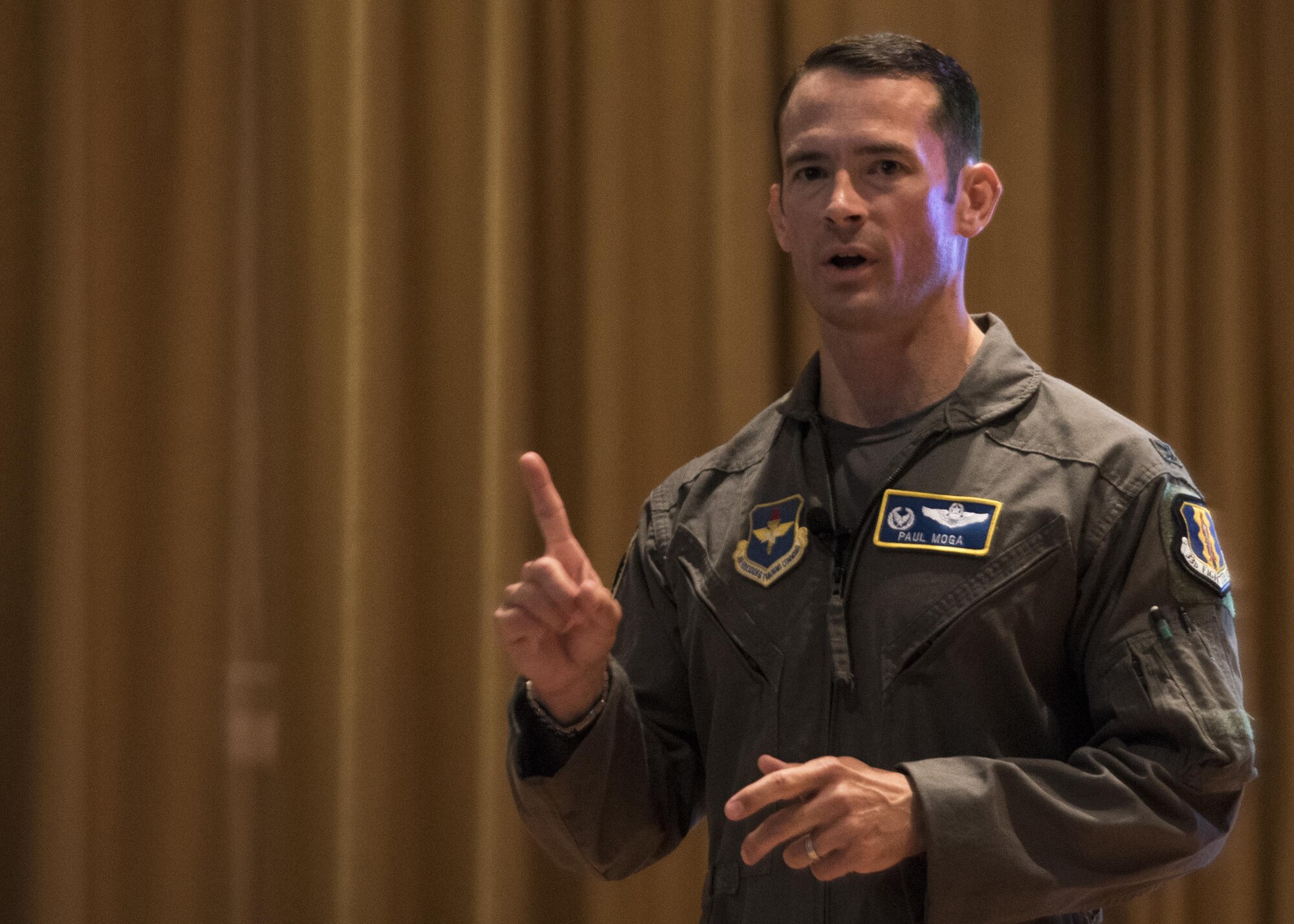U.S. Air Force Col. Paul Moga, 33rd Fighter Wing commander, discusses his priorities during his first all-call May 19, 2017, at Eglin Air Force Base, Florida. Moga explained that Nomads should be loyal to themselves, their country and their families, including their extended family within the wing. (U.S. Air Force photo by Staff Sgt. Peter Thompson)