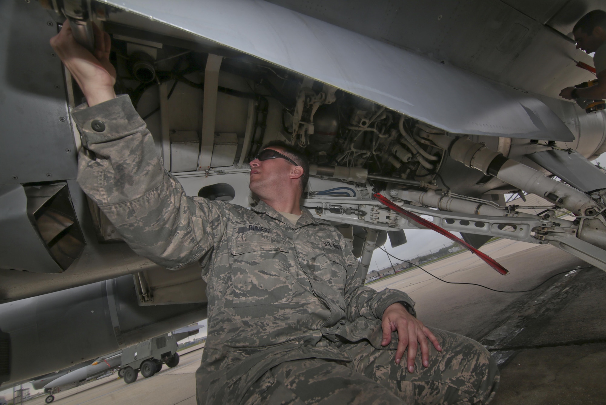 New Jersey Air National Guard Tech. Sgt. Sean Romero from the 177th Aircraft Maintenance Squadron looks over an F-16D Fighting Falcon during a three-day Aeropsace Control Alert CrossTell live-fly training exercise at Atlantic City Air National Guard Base, N.J., May 23, 2017. Representatives from Air National Guard fighter wings, Civil Air Patrol, and U.S. Coast Guard rotary-wing air intercept units will conduct daily sorties from May 23-25 to hone their skills with tactical-level air-intercept procedures. (U.S. Air National Guard photo by Master Sgt. Matt Hecht/Released)