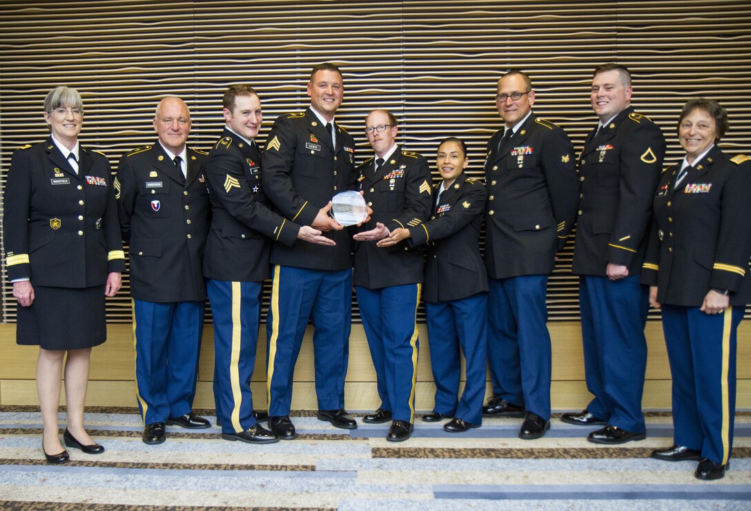 Brig. Gen. Kelly Wakefield (far left), U.S. Army Reserve deputy commanding general of the 200th Military Police Command, and Chief Warrant Officer 4 Kim R. Shiner (far right), U.S. Army Reserve food service leader, stand with Soldiers from the 391st Military Police Battalion, of Columbus, Ohio, who attend a dinner ceremony for The Philip A. Connelly Awards in Chicago, Illinois on May 19, 2017. The Department of the Army’s Connelly Awards is an annual military competition, which uses military and civilian evaluators from the National Restaurant Association to recognize military units for excellence in Army food service. This year’s winner was the 391st MP Bn., under the 200th MP Command, representing the U.S. Army Reserve. Winning teams from the active components and National Guard also attended the dinner. (U.S. Army Reserve photo by Maj. Saphira Ocasio)