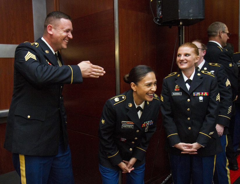 Sgt. Matthew Lewis, Spc. Consuelo Hengstenberg, and Sgt. Stephanie Rudasill, U.S. Army Reserve Soldiers from the 391st Military Police Battalion, of Columbus, Ohio, joke around while attending a dinner ceremony for The Philip A. Connelly Awards in Chicago, Illinois on May 19, 2017. The Department of the Army’s Connelly Awards is an annual military competition, which uses military and civilian evaluators from the National Restaurant Association to recognize military units for excellence in Army food service. This year’s winner was the 391st MP Bn., under the 200th MP Command, representing the U.S. Army Reserve. Winning teams from the active components and National Guard also attended the dinner. (U.S. Army Reserve photo by Maj. Saphira Ocasio)