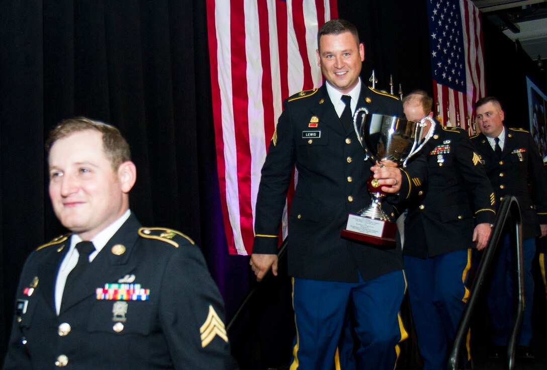 Sgt. Matthew Lewis, a U.S. Army Reserve Soldier from the 391st Military Police Battalion, of Columbus, Ohio, holds the Philip A. Connelly Award trophy during a ceremonial dinner in Chicago, Illinois on May 19, 2017. The Department of the Army’s Connelly Awards is an annual military competition, which uses military and civilian evaluators from the National Restaurant Association to recognize military units for excellence in Army food service. This year’s winner was the 391st MP Bn., under the 200th MP Command, representing the U.S. Army Reserve. Winning teams from the active components and National Guard also attended the dinner. (U.S. Army Reserve photo by Maj. Saphira Ocasio)