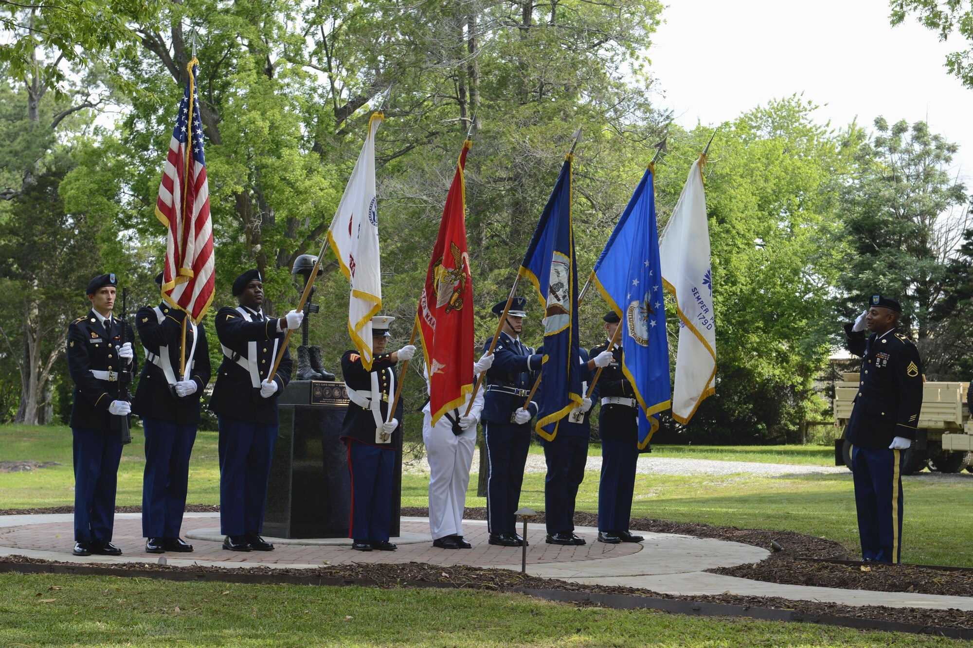 The U.S. Joint Service Color Guard presents the colors during the Bronze Cross Statue Memorial Wreath Laying Ceremony at Joint Base Langley-Eustis, Va., May 20, 2017. A 21-gun salute was performed in honor of the fallen U.S. service members. (U.S. Air Force photo/Airman 1st Class Kaylee Dubois)