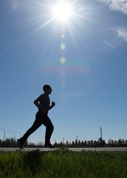 An Airman participates in the 5K Memorial Run during National Police Week at Minot Air Force Base, N.D., May 18, 2017. Base personnel, local law enforcement and their families were invited to participate in the run in honor of currently serving law enforcement personnel. (U.S. Air Force photo/Airman 1st Class Alyssa M. Akers)