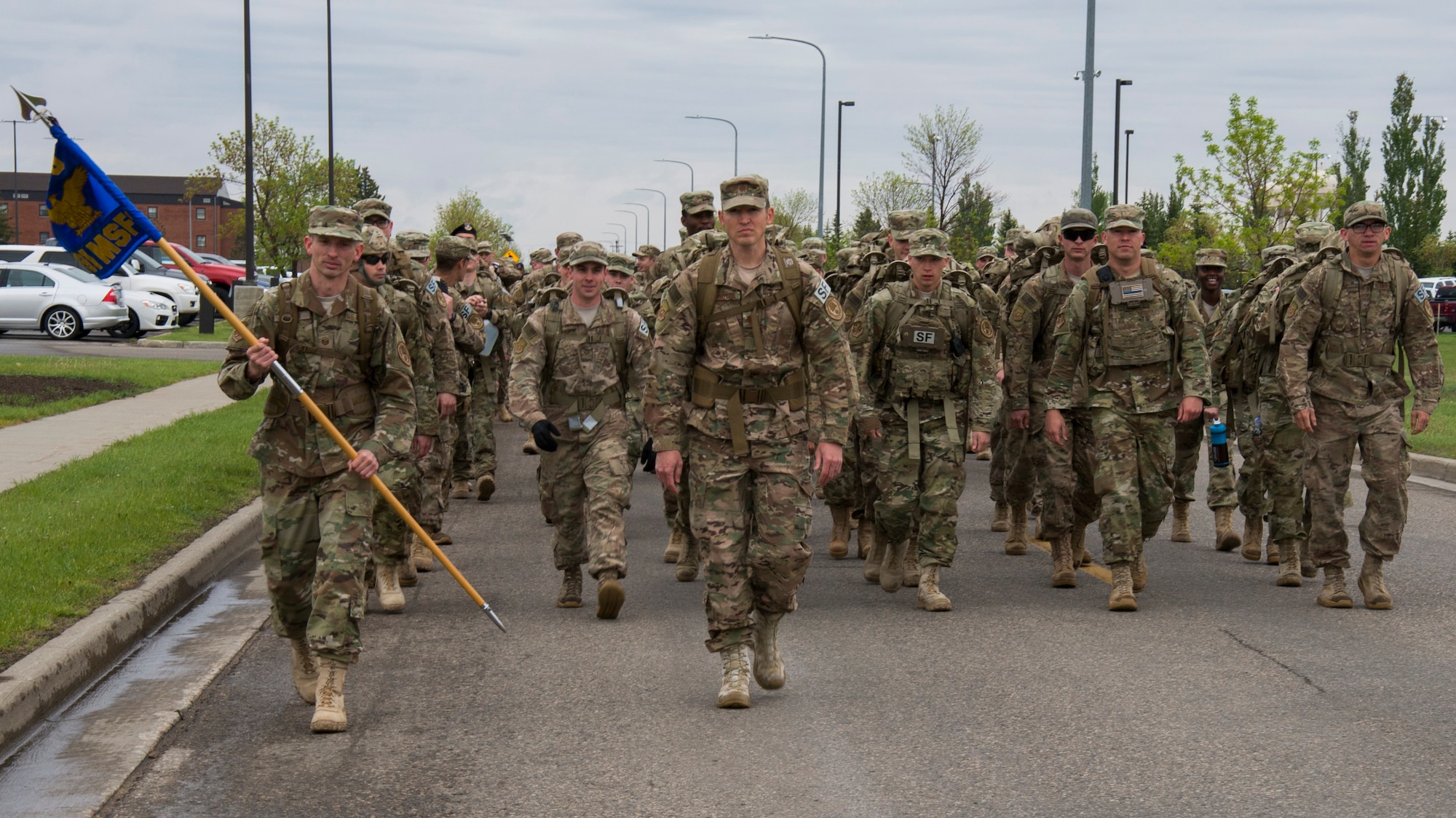 Airmen with the 91st Security Forces Group begin a 5K Remembrance Ruck March in honor of National Police Week at Minot Air Force Base, N.D., May 16, 2017. Base personnel and local law enforcement were invited to participate in the march to honor fallen law enforcement personnel. (U.S. Air Force photo/Airman 1st Class Alyssa M. Akers)