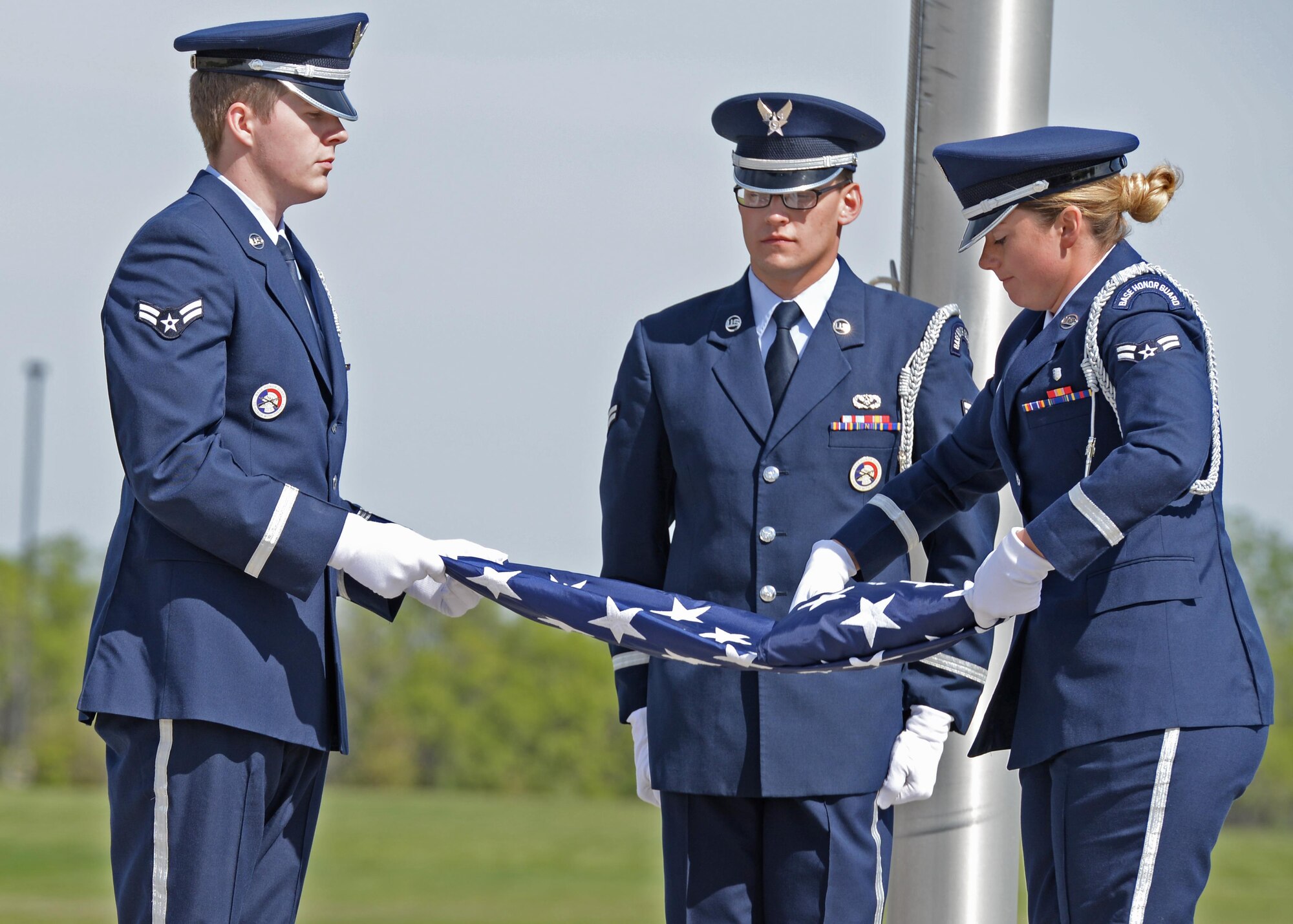 Minot Air Force Base, N.D., Honor Guard Airmen fold the flag during the National Police Week retreat ceremony May 19, 2017. A retreat ceremony is the daily military practice of lowering the flag. (U.S. Air Force photo/Airman 1st Class Austin M. Thomas)