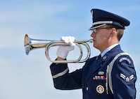 Airman 1st Class Douglas Newton, 5th Civil Engineer Squadron structural apprentice, plays the trumpet during a National Police Week retreat ceremony at Minot Air Force Base, N.D., May 19, 2017. National Police Week honors law enforcement personnel around the world who have made the ultimate sacrifice. (U.S. Air Force photo/Airman 1st Class Austin M. Thomas)