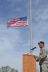 Senior Airman Eduardo Virgil, 5th Security Forces Squadron desk sergeant, recites fallen officers’ names during a National Police Week retreat ceremony at Minot Air Force Base, N.D., May 19, 2017. A retreat ceremony is the daily military practice of lowering the flag. (U.S. Air Force photo/Airman 1st Class Austin M. Thomas)