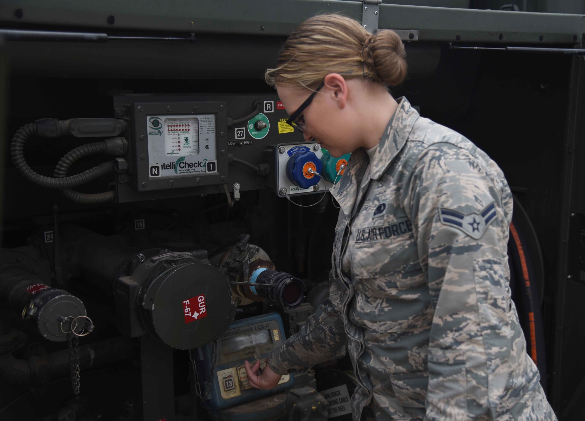 Airman 1st Class Kaitlin Reynolds, 22nd Logistics Readiness Squadron Fuels Distributions technician, checks gauges on a fuels truck May 11, 2017, at McConnell Air Force Base, Kan. The fuels flight is responsible for receiving, issuing, maintaining, storing and testing all aviation and ground-product fuels that come into the base for every aircraft and vehicle. (U.S. Air Force photo/Airman 1st Class Erin McClellan)