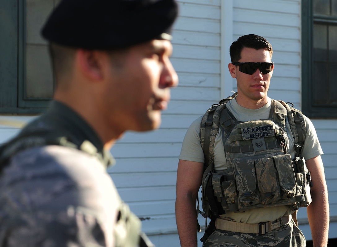 Senior Airman Scott Mefford, Joint Base Security Forces (JBSF) police services clerk, listens to Capt. Joseph Cortez, Joint Base Security Forces (JBSF) operations officer, speak before the Police Week Ruck March, on Joint Base Pearl Harbor-Hickam, Hawaii, May 19, 2019.  According to the National Peace Officer’s Memorial Fund website, National Police Week was established in 1962 by President John F. Kennedy to pay tribute to law enforcement officers who lost their lives in the line of duty. Ceremonies and observances are held annually throughout the U.S. in remembrance of fallen officers.  (U.S. Air Force photo by Tech. Sgt. Heather Redman)