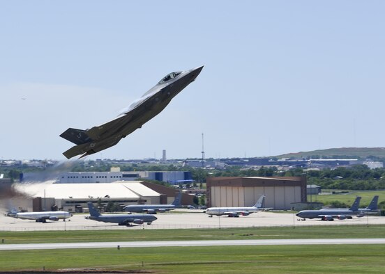 An F-35A Lightning II takes flight during the 2017 Star Spangled Salute air show at Tinker AFB May 21.  The joint strike fighter was one of more than 50 statics and aerial acts on display for the air show as record crowds helped Tinker celebrate its 75th anniversary as well as the Air Force 70th birthday.  (U.S. Air Force photo/Mark Hybers)