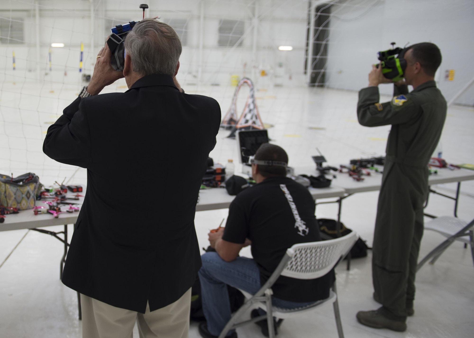 Retired Gen. John Jumper, former U.S. Air Force chief of staff, and Col. Houston Cantwell, 49th Wing commander, participate in a virtual drone racing demo on Holloman Air Force Base, N.M., May 19, 2017. During his visit he was updated on current Remotely Piloted Aircraft training, given a look into the possibilities of future unmanned aircraft technology, and a virtual drone racing obstacle course demonstration. Jumper is most known within the RPA community for his work arming the MQ-1 Predator. (U.S. Air Force Photo by Senior Airman Chase Cannon)