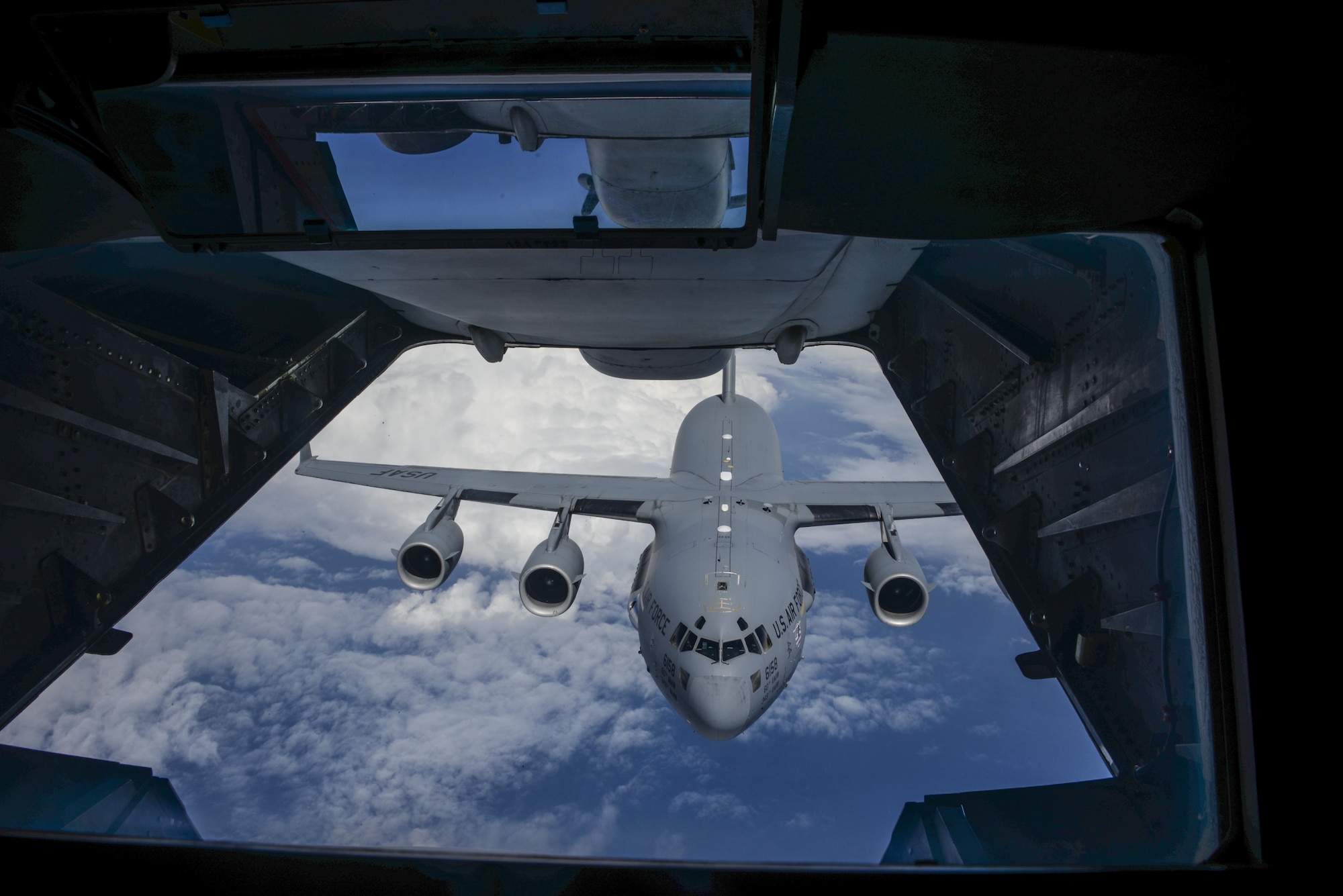 A KC-10 Extender conducts air refueling with a C-17 Globemaster III May 11 at Travis Air Force Base, California. Members of the California Highway Patrol joined the 6th and 9th Air Refueling Squadrons on a KC-10 training flight, where they were able to learn more about the base mission. (U.S. Air Force photo / 2nd Lt. Sarah Johnson)