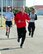 Members from the 60th, 349th and 821st Aerial Port Squadrons participate in the annual 5K Port Dawg Memorial Run at Travis Air Force Base, Calif., May 17, 2017. The run honors the memories of four fallen heroes, Master Sgt. William Davis, Master Sgt. Kelly Bartholomew, Staff Sgt. Jonathan Turner and Airman 1st Class Russel Deleon. (U.S. Air Force photo by Louis Briscese)