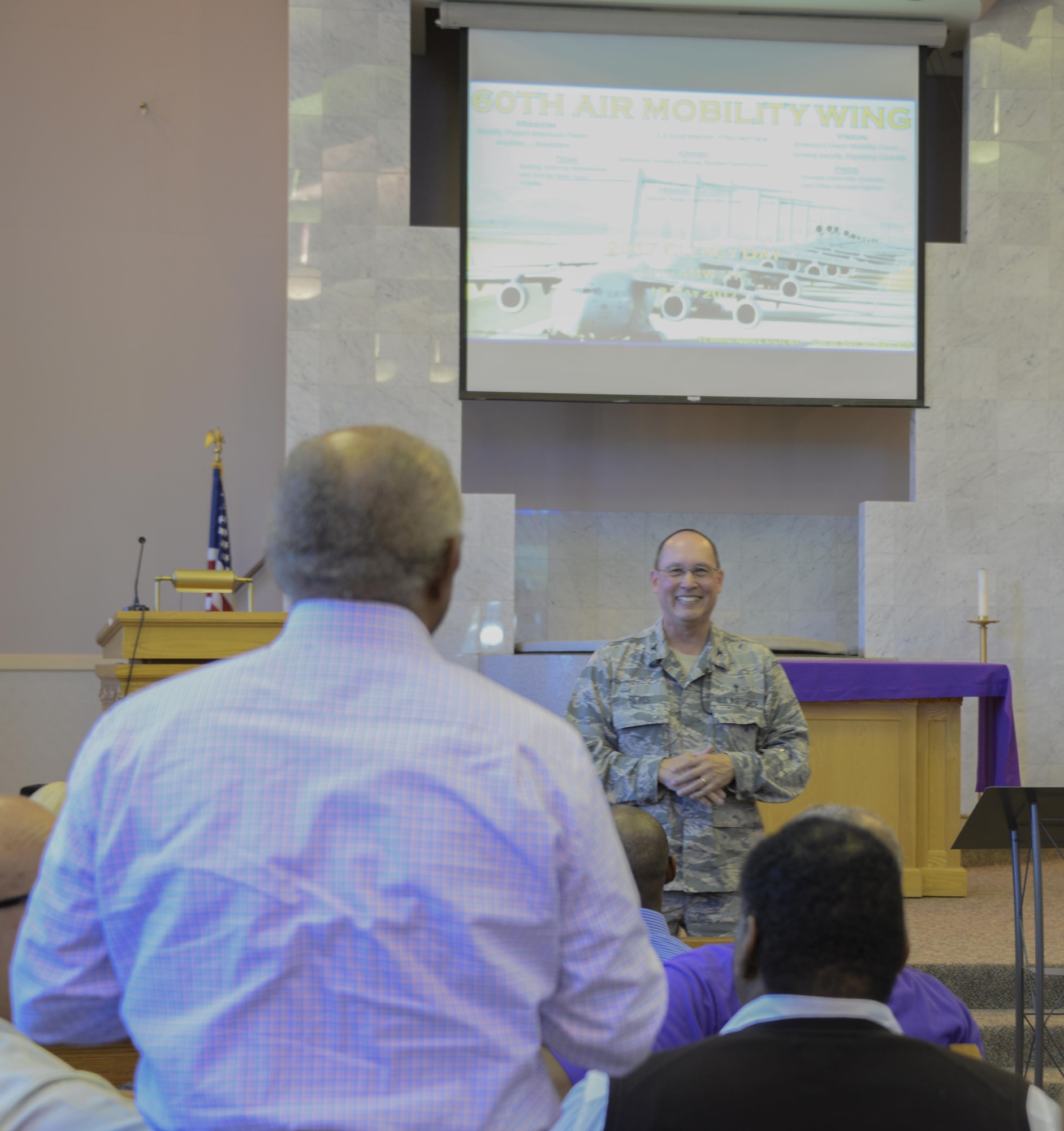 Col. Kenneth Reyes, 60th Air Mobility Wing head chaplain, interacts with local clergy members during Clergy Day May 18 at Travis Air Force Base, Calif. The purpose of the event was to inform and educate leaders from off-base religious services from a variety of faiths about life at Travis, particularly for children and young Airmen in their teens and early 20s.
