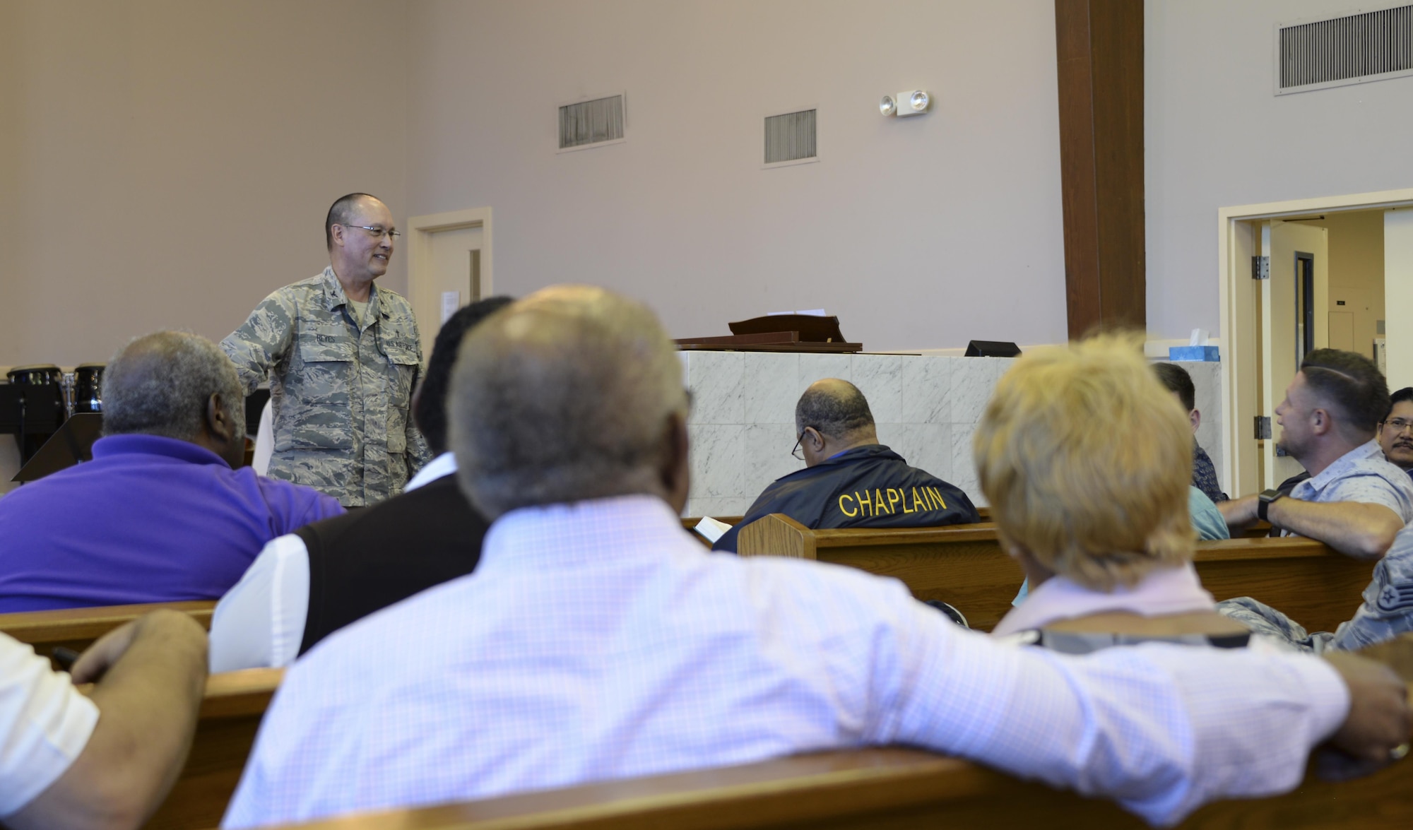 Col. Kenneth Reyes, 60th Air Mobility Wing head chaplain, interacts with local clergy members during Clergy Day May 18 at Travis Air Force Base, Calif. The purpose of the event was to inform and educate leaders from off-base religious services from a variety of faiths about life at Travis, particularly for children and young Airmen in their teens and early 20s.
