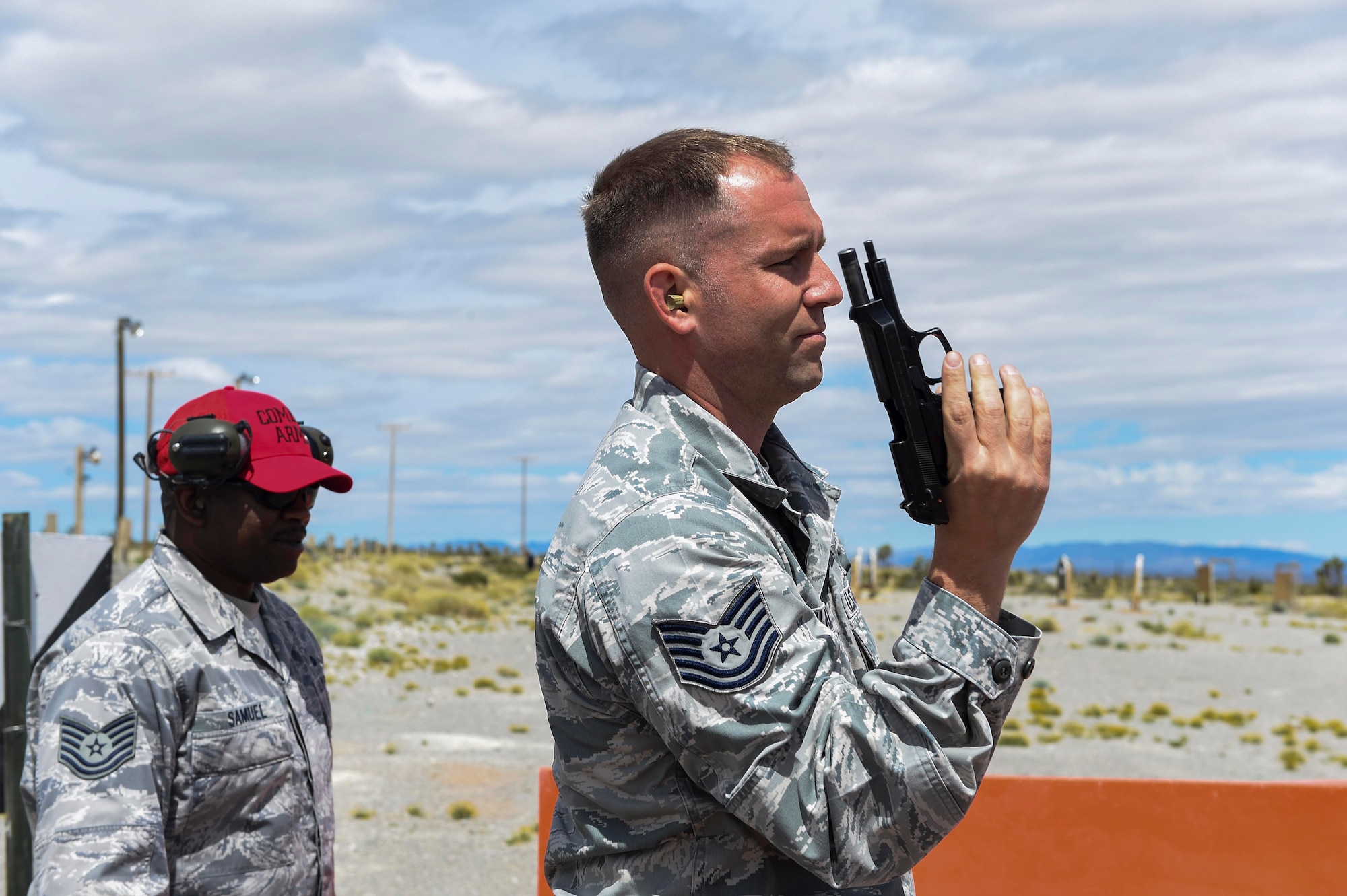 Tech Sgt. Kennedy clears his weapon during the Nellis/Creech Law enforcement pistol shoot May 15, 2016, at Silver Flag Alpha, Nevada. National Police Week dates back to 1962 when President John F. Kennedy signed a proclamation to honor the law enforcers who paid the ultimate sacrifice (U.S. Air Force photo Airman 1st  Class Adarius Petty)