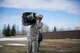 U.S. Air Force Airman 1st Class Jerred Davis, a 354th Civil Engineer Squadron pavement and construction equipment operator, carries a hose April 10, 2017, at Eielson Air Force Base, Alaska. During the break-up season, Airmen in the Snow Barn use hoses to move water away from the flight line to ensure the flying mission is not affected. (U.S. Air Force photo by Airman 1st Class Isaac Johnson)