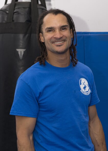 Michael Johnson, master combative instructor, poses for a photo during a team-building combative training, May 12, 2017, at Yokota Air Base, Japan. Johnson trained Airmen from the 459th Airlift Squadron to better build their confidence and skills to react when confronted by a violent and hostile person. (U.S. Air Force photo by Airman 1st Class Juan Torres)